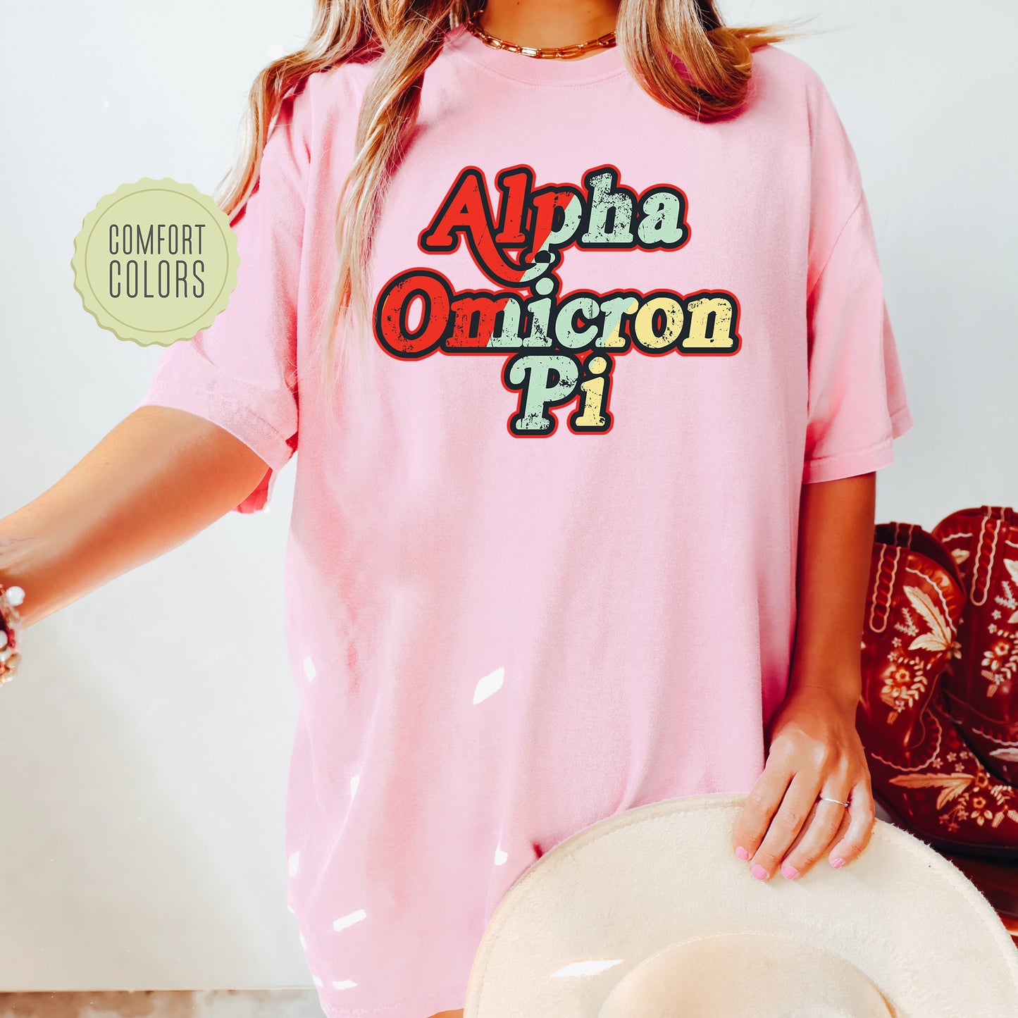 a woman wearing a pink shirt and hat