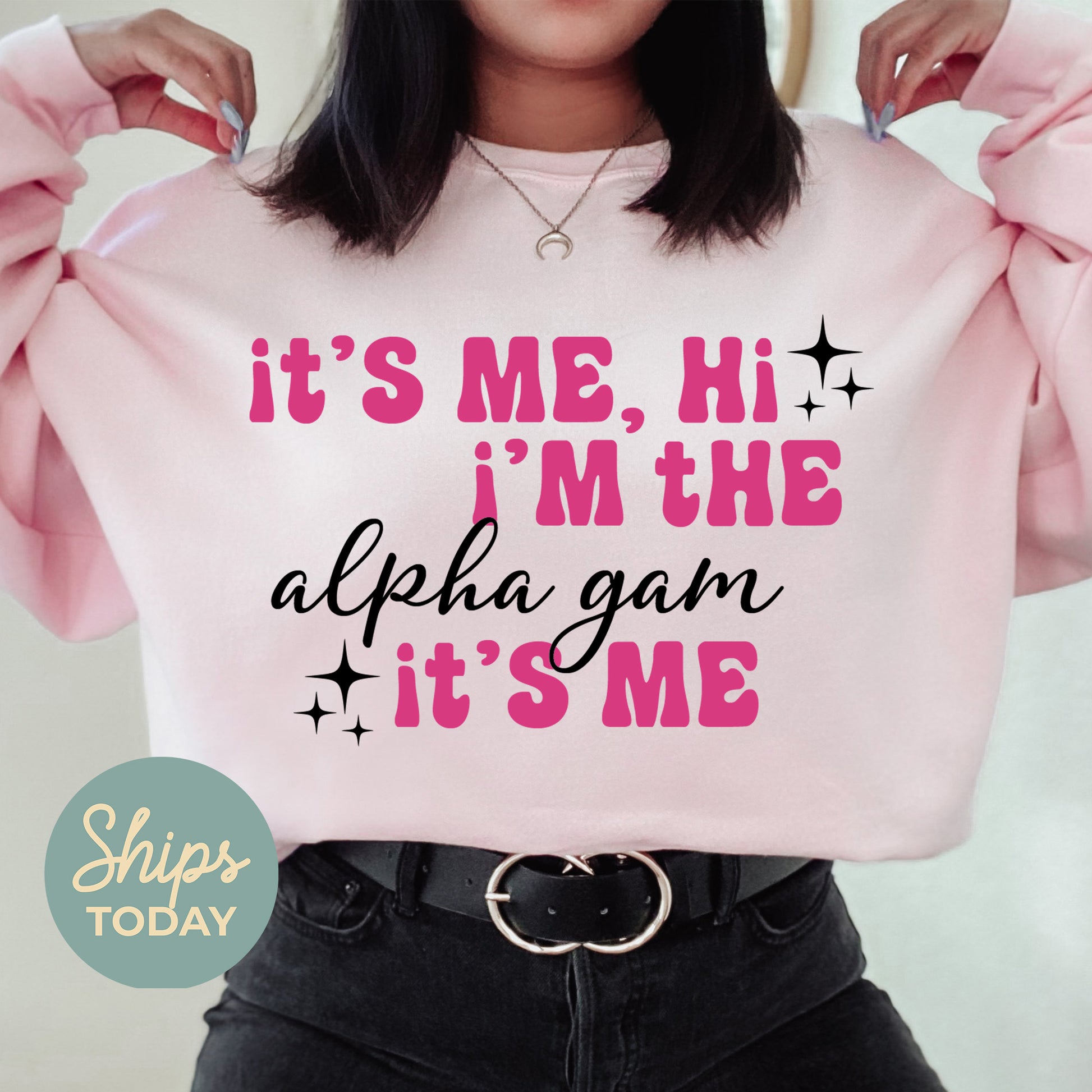 a woman wearing a pink sweatshirt that says it's me, i'm