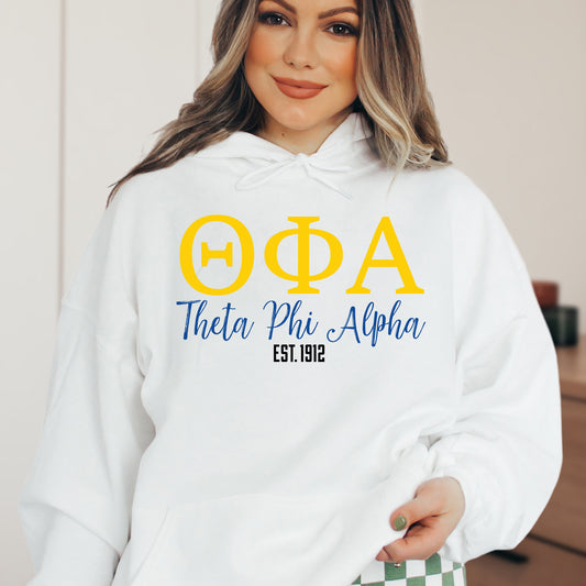 a woman wearing a white hoodie with greek letters
