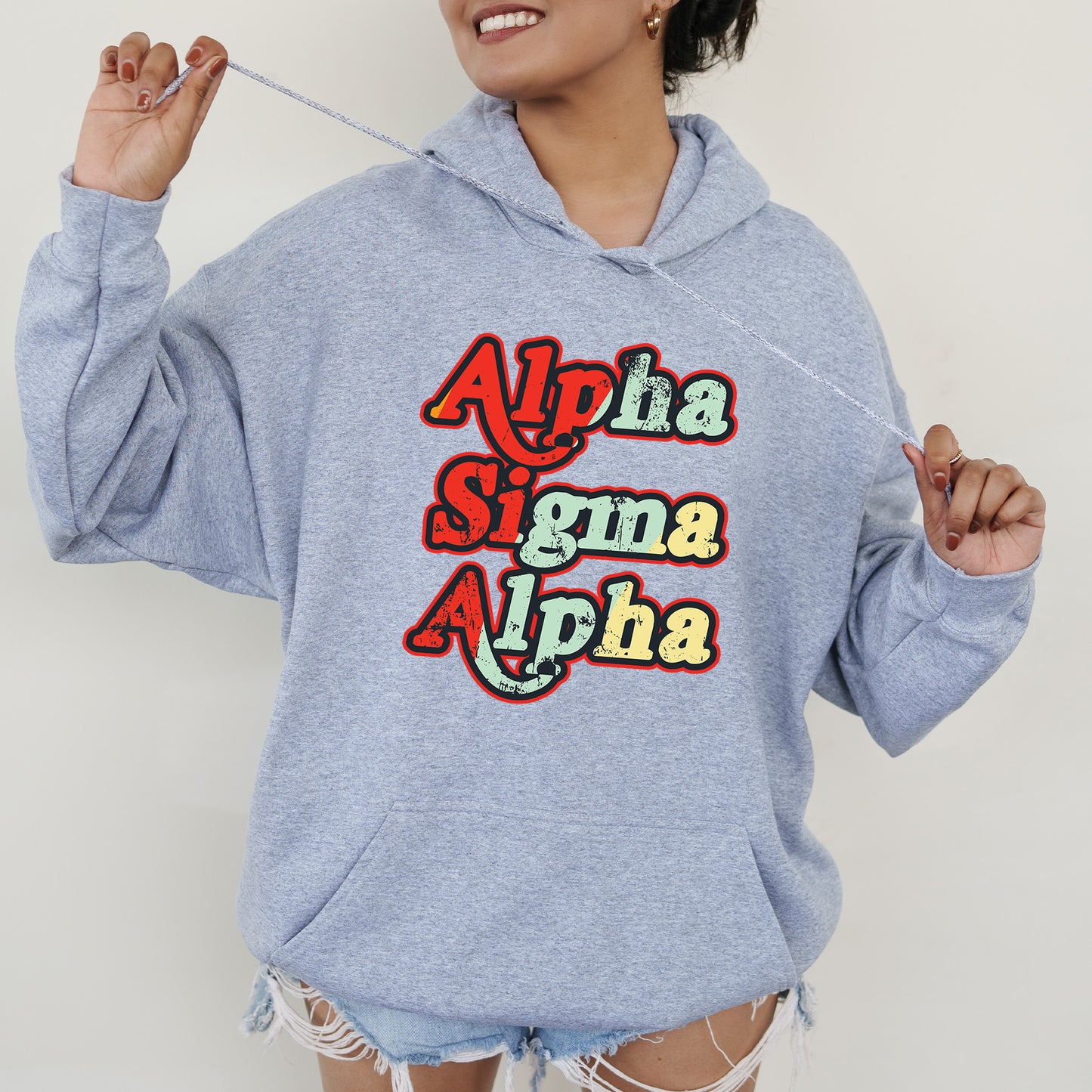 a woman wearing a blue sweatshirt with the words aloha and aloha