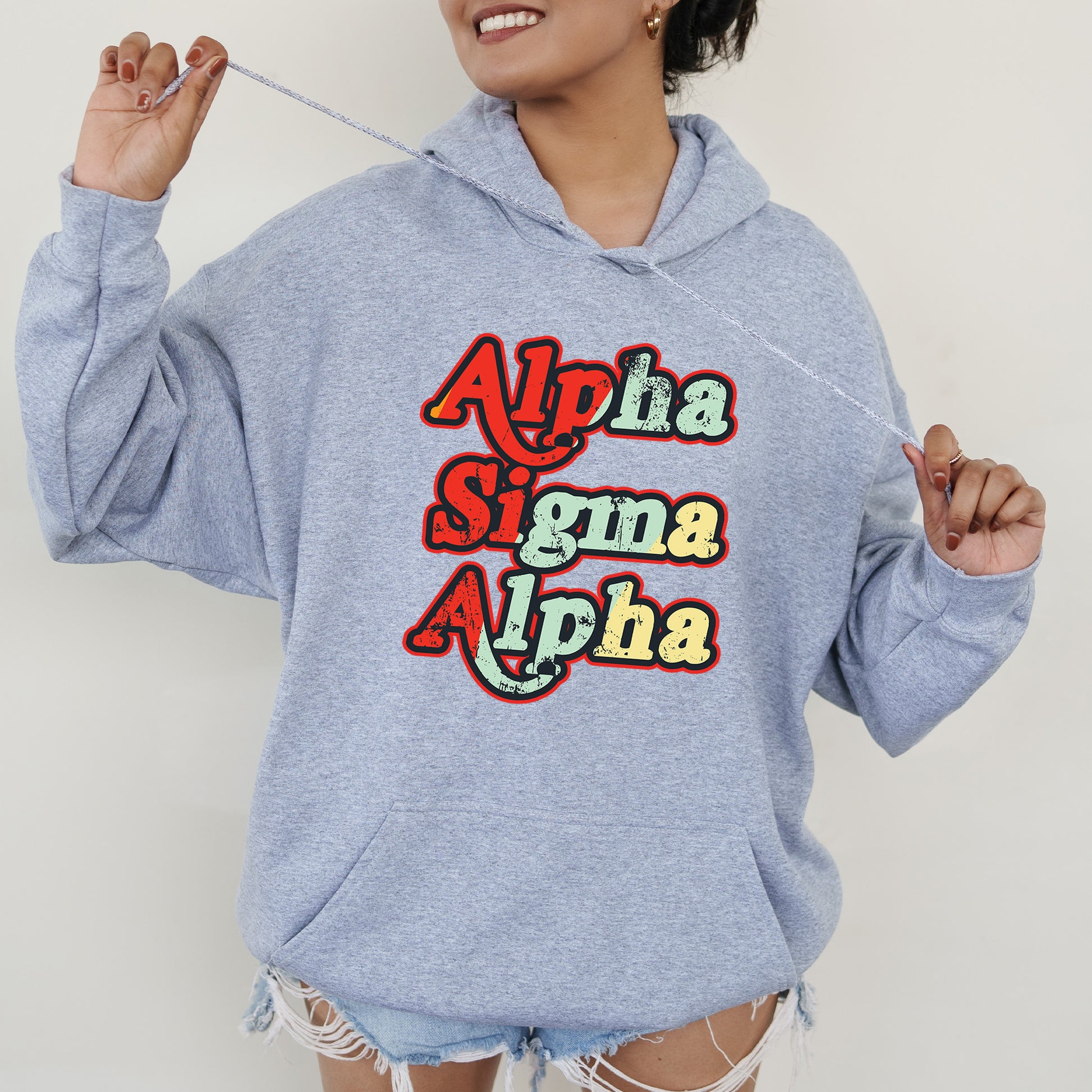 a woman wearing a blue sweatshirt with the words aloha and aloha