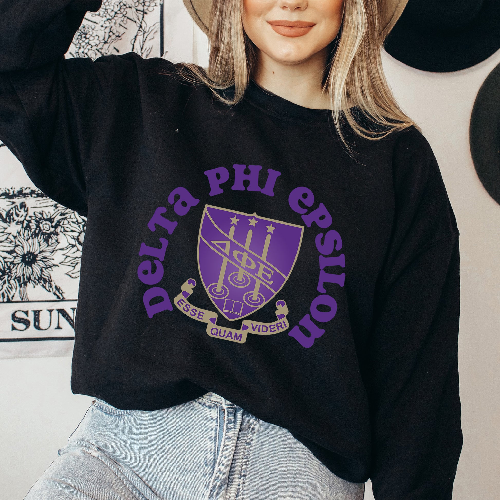 a woman wearing a hat and a sweatshirt