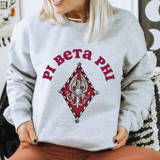 a woman sitting on a chair wearing a sweatshirt