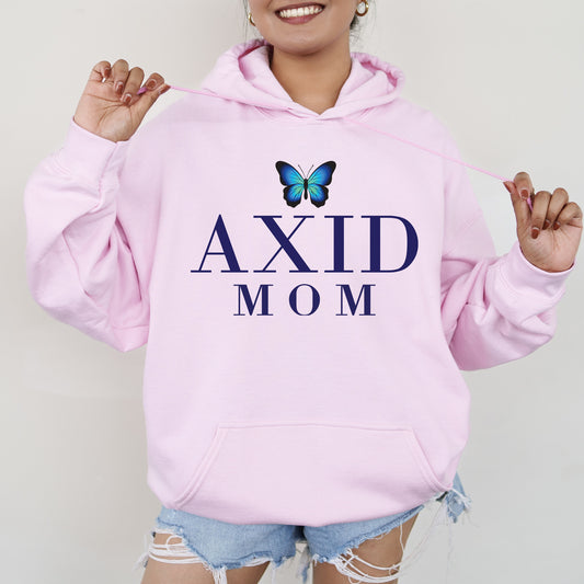 a woman wearing a pink hoodie with a butterfly on it