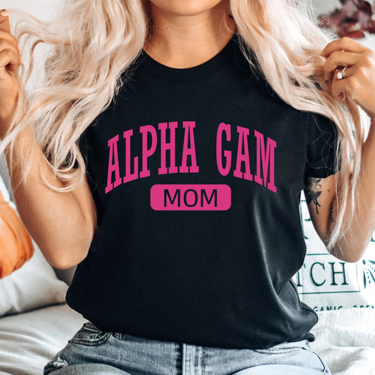 a woman wearing a black shirt with pink letters on it