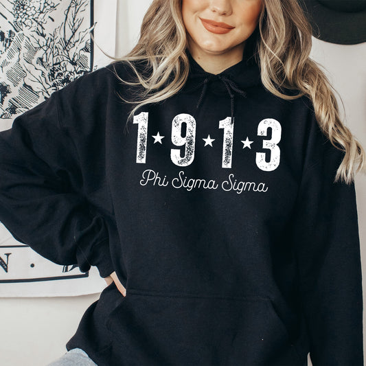 a woman wearing a black hoodie with the number 1911 printed on it
