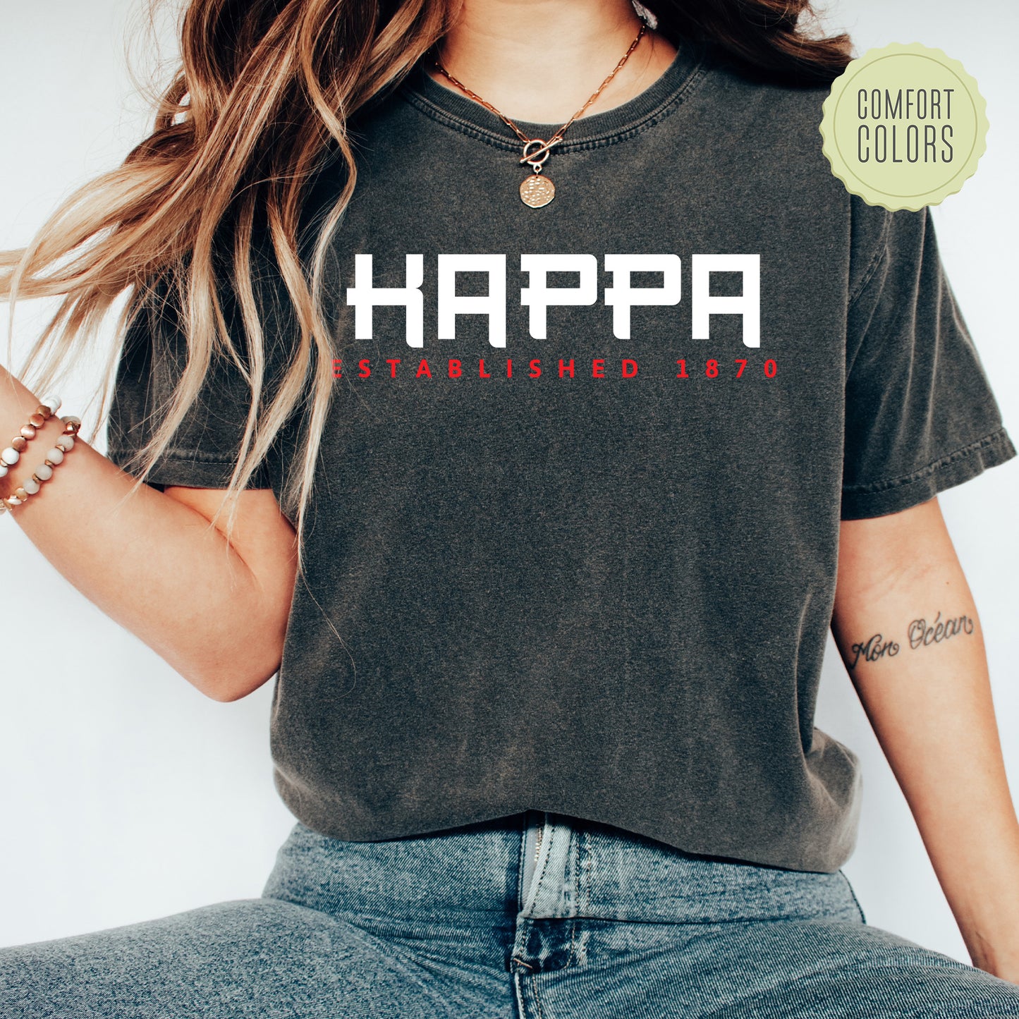 a woman wearing a shirt that says happa