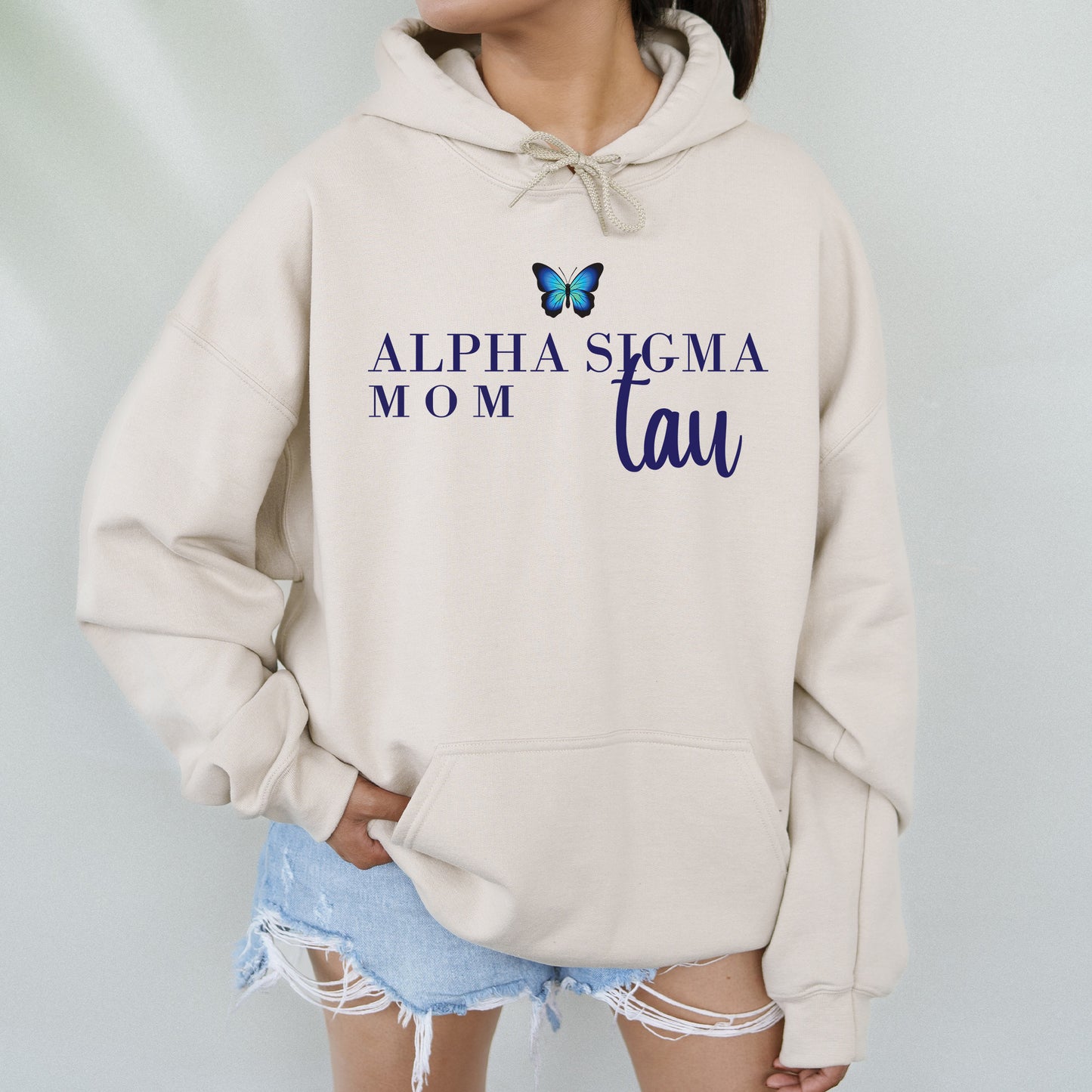 a woman wearing a sweatshirt with a butterfly on it