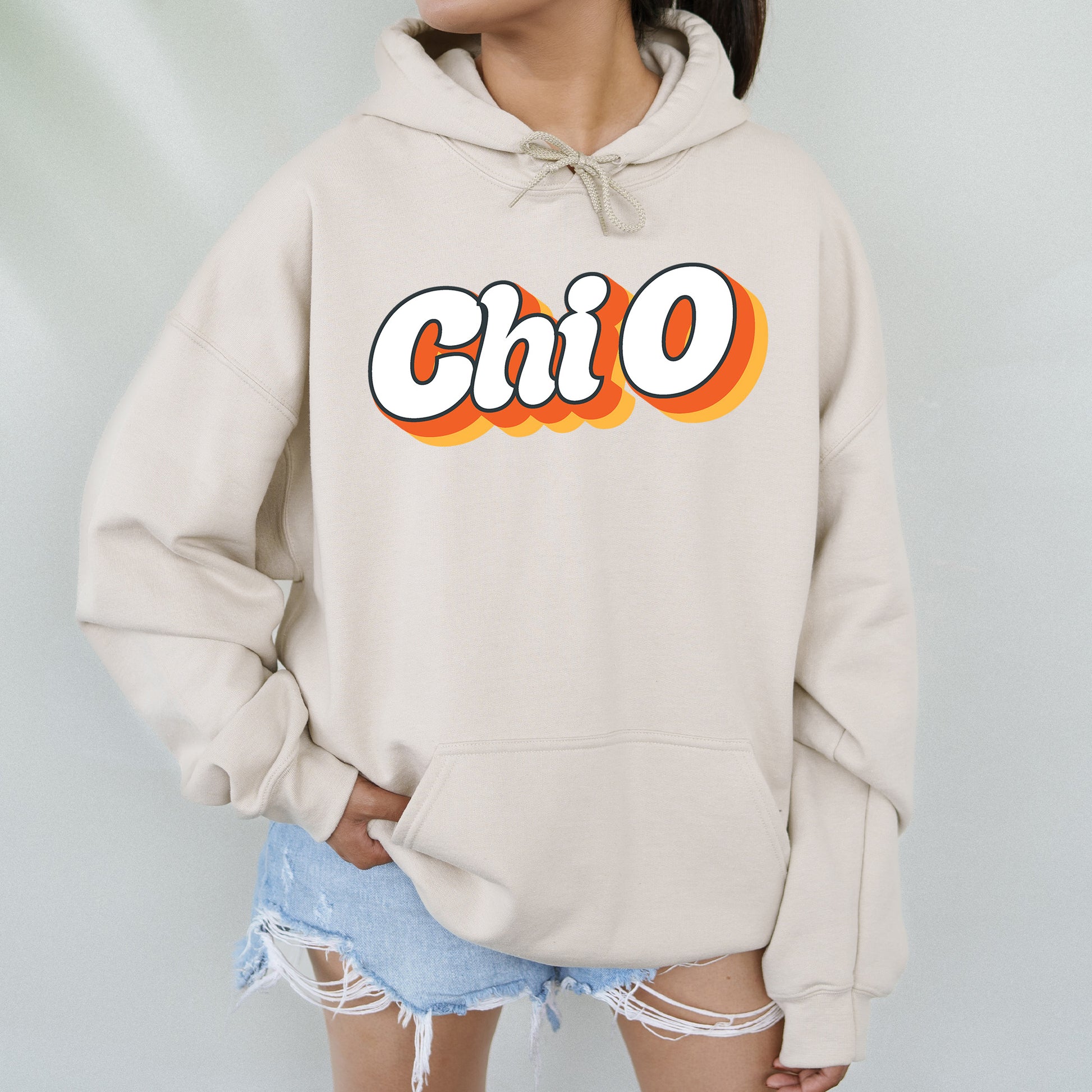 a woman wearing a hoodie with the word chio on it