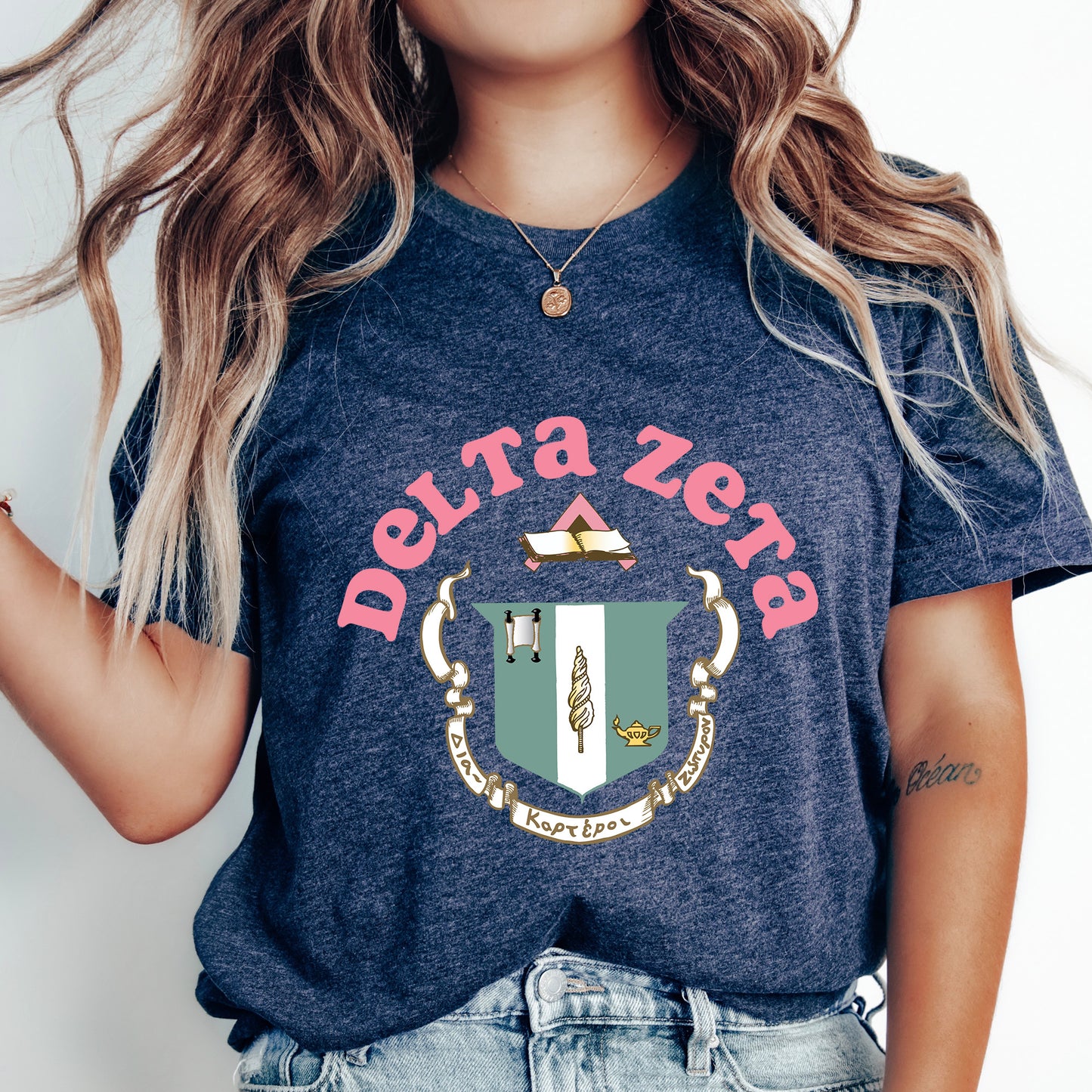 a woman wearing a t - shirt with a crest on it