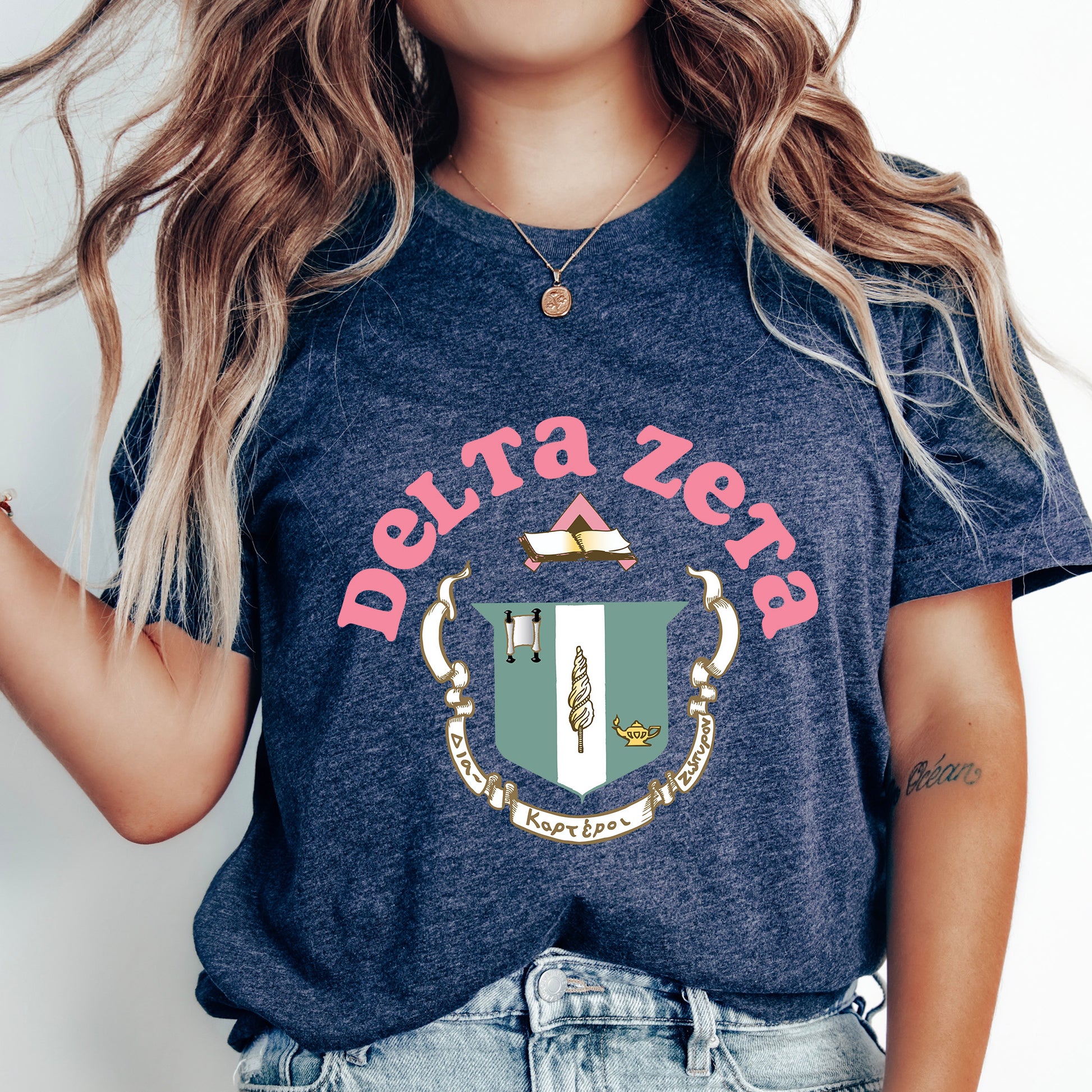 a woman wearing a t - shirt with a crest on it