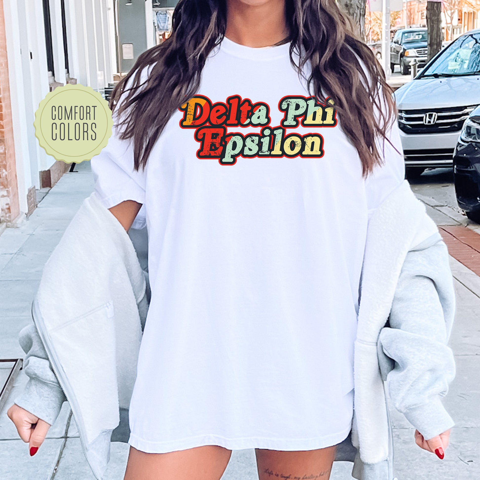 a woman wearing a white shirt and shorts