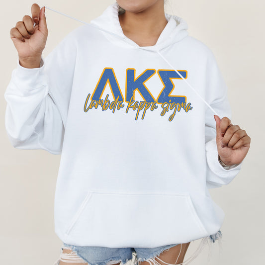 a woman wearing a white hoodie with the letters ake on it