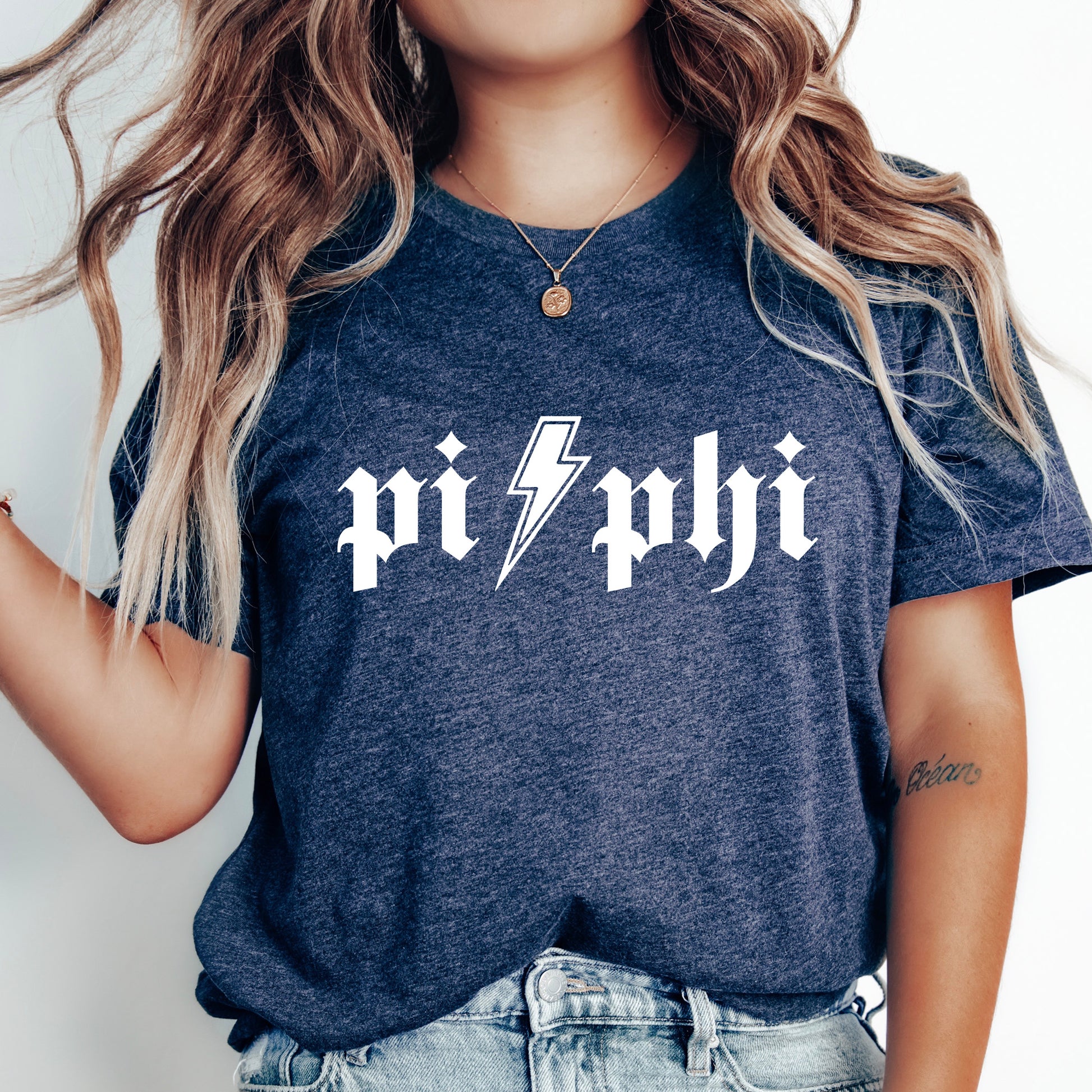 a woman wearing a t - shirt with a lightning bolt on it