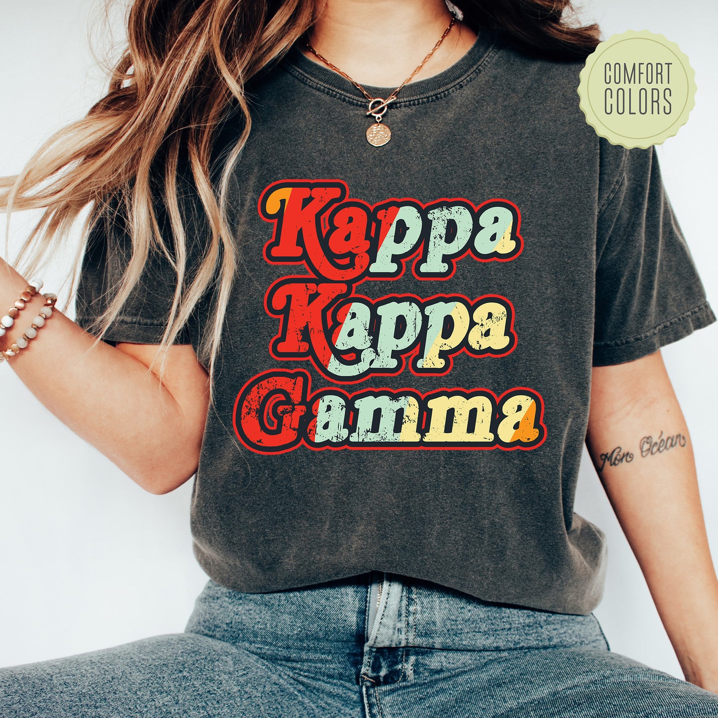 a woman wearing a t - shirt that says kapa kapa gama