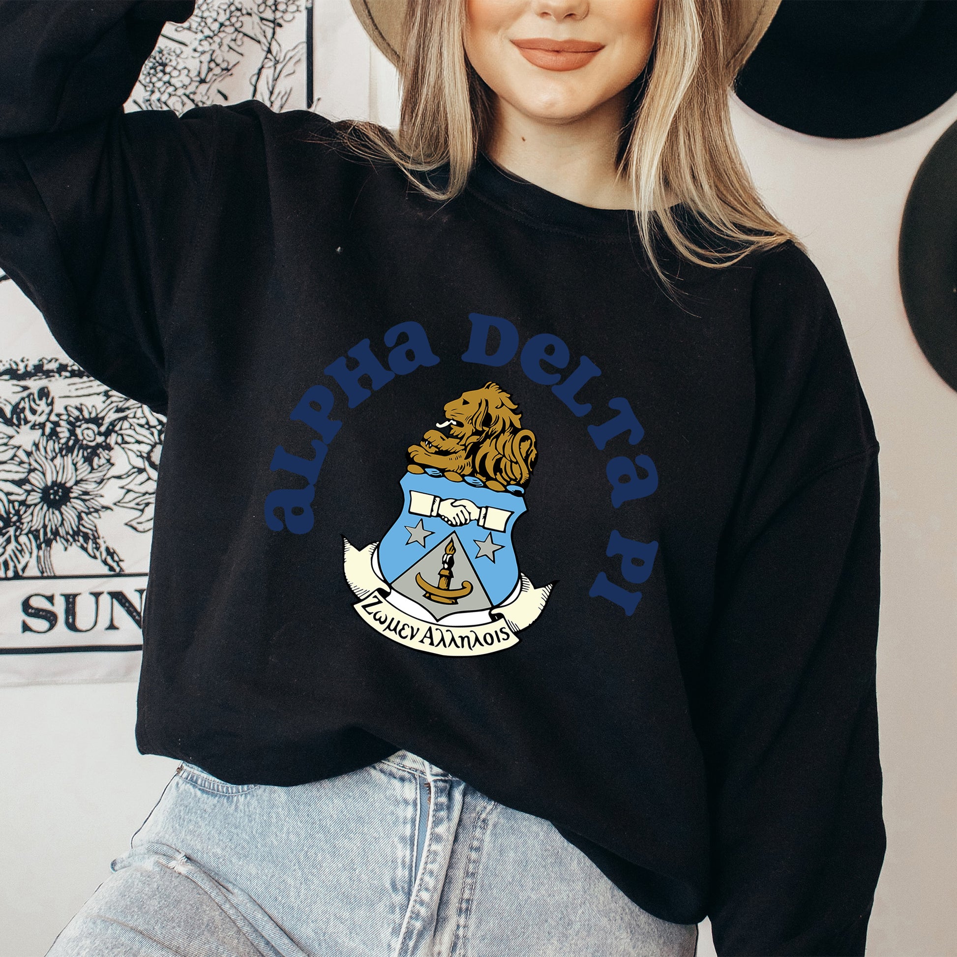 a woman wearing a hat and a black sweatshirt