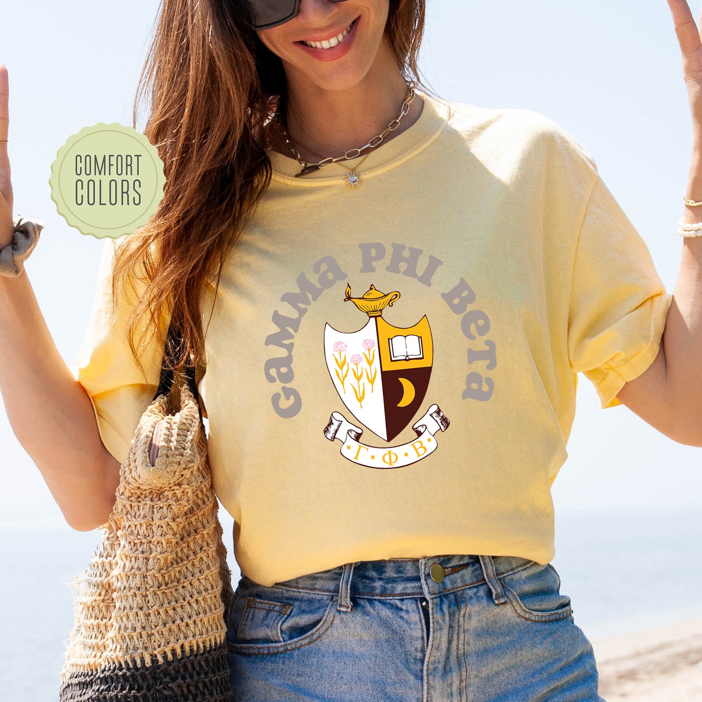 a woman in a yellow shirt holding up a peace sign