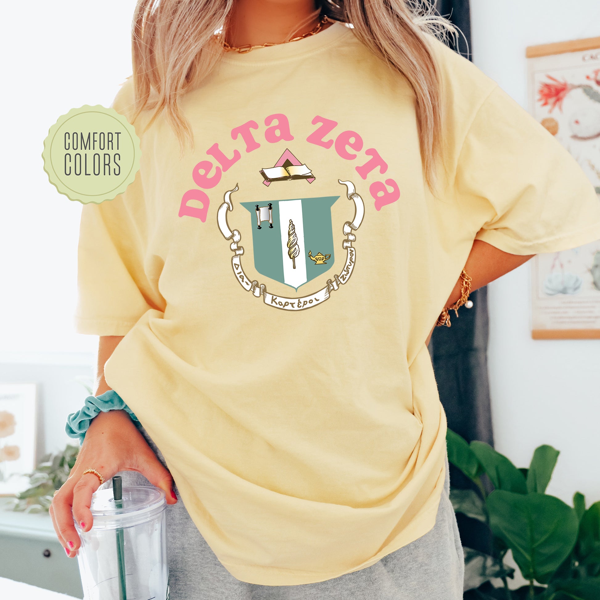 a woman in a yellow shirt holding a blender