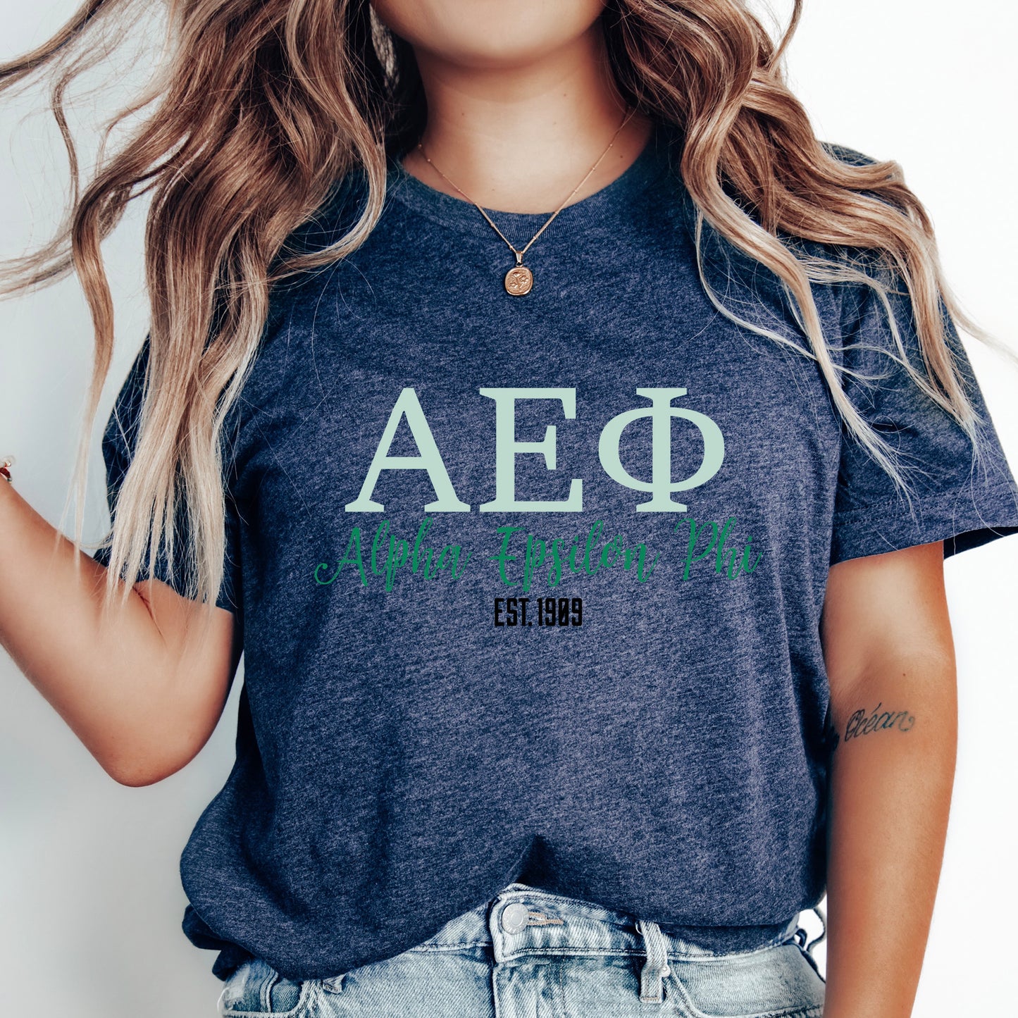 a woman wearing a t - shirt that says aeg