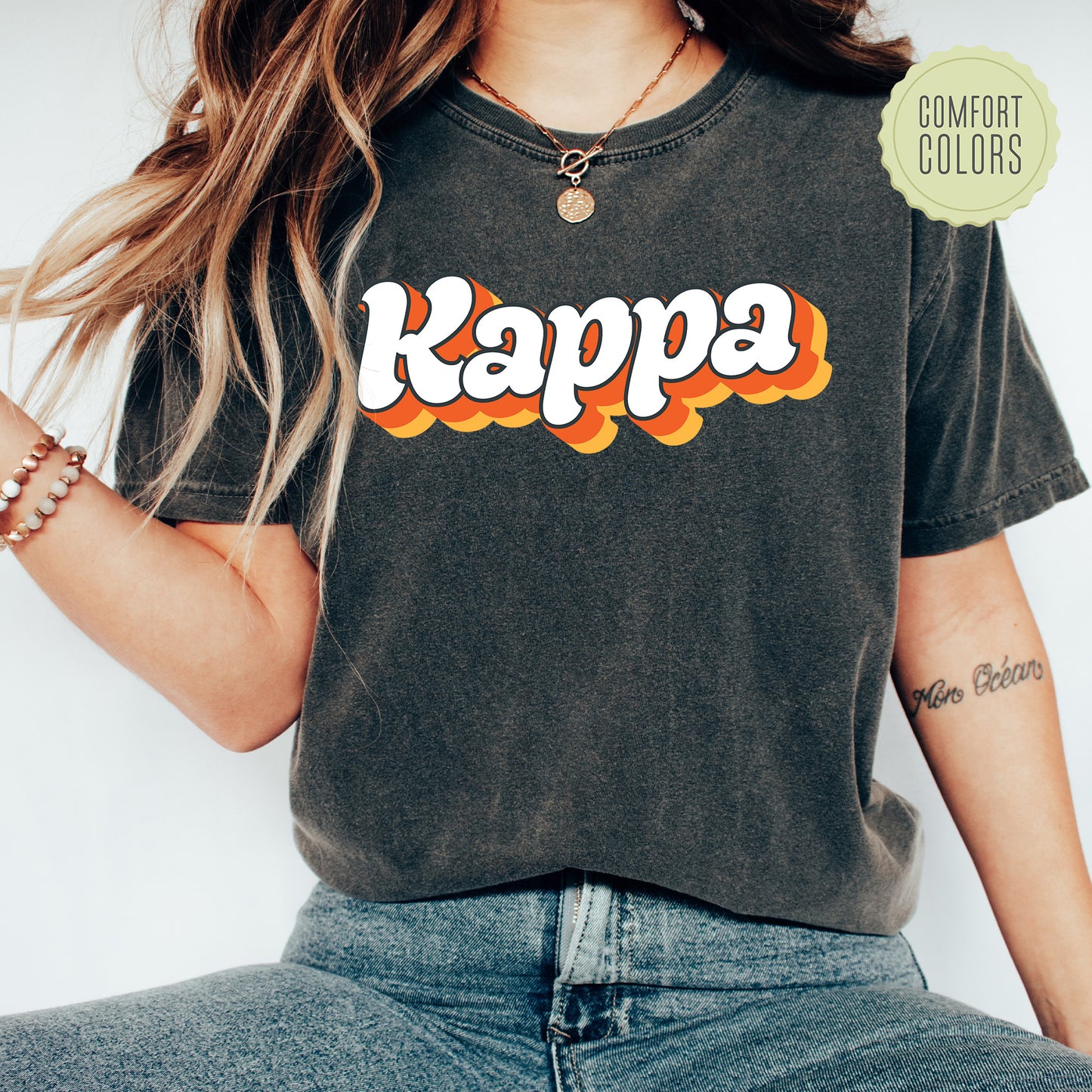 a woman wearing a black shirt with the word kappa on it