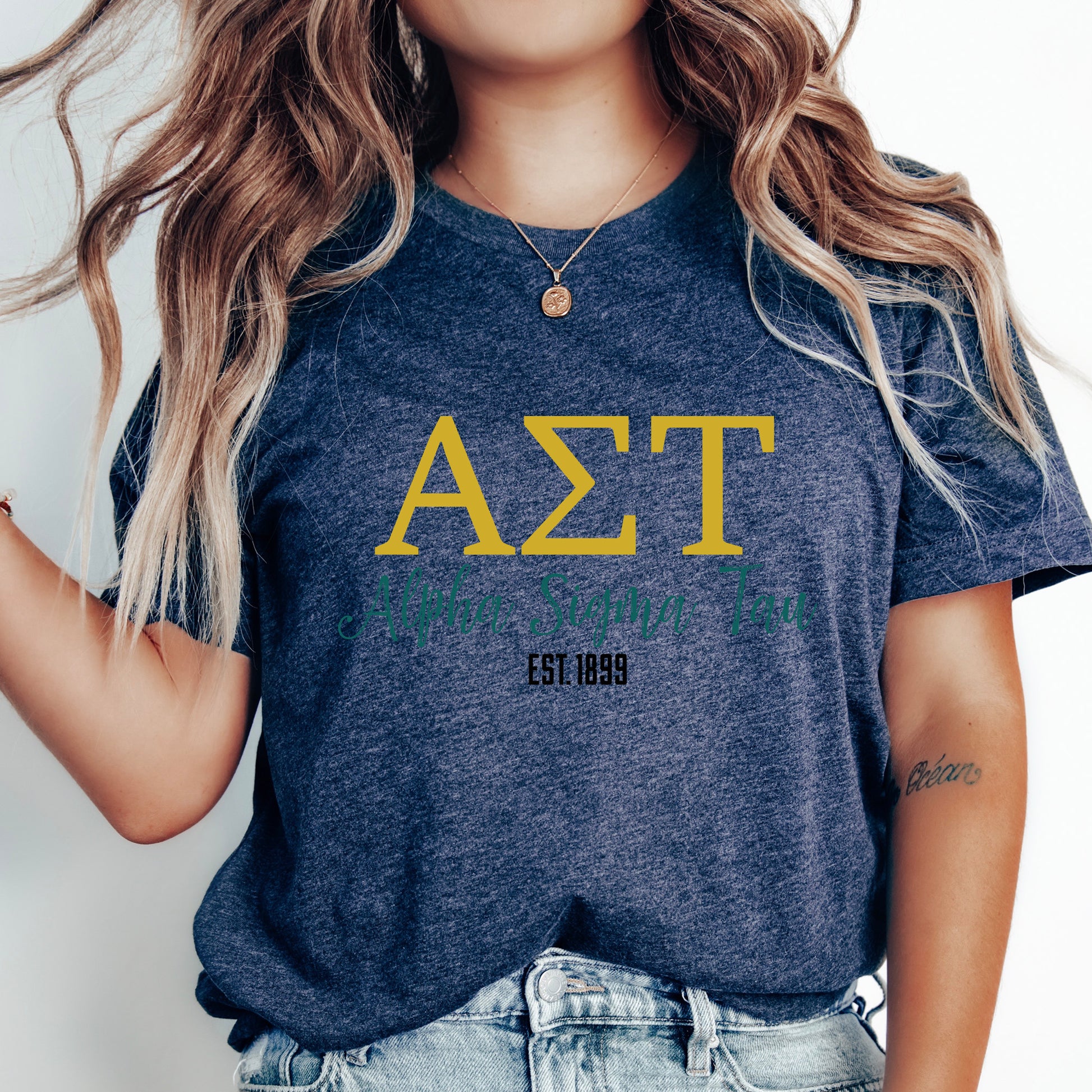 a woman with long hair wearing a delta t - shirt