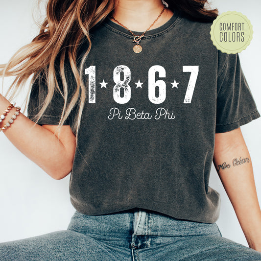 a woman wearing a t - shirt with the number sixty seven on it
