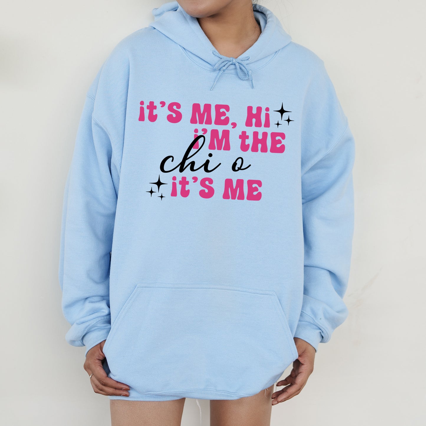 a person wearing a blue hoodie that says it's me, i '