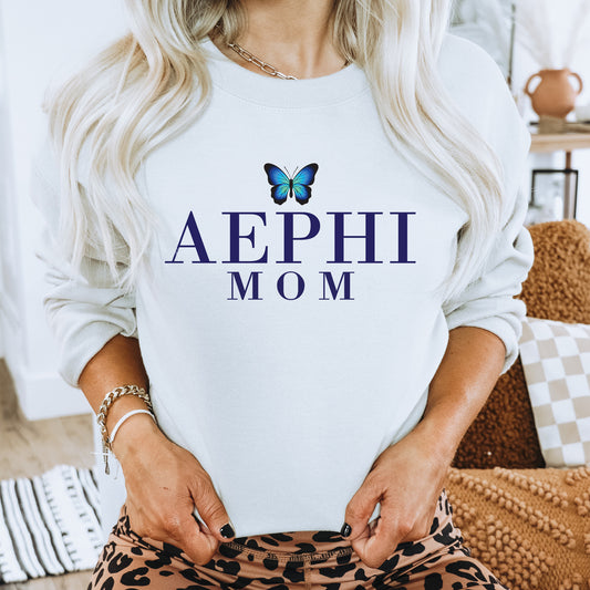 a woman wearing a sweatshirt with a butterfly on it