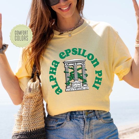 a woman in a yellow shirt is holding up a peace sign