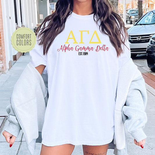 a woman wearing a white shirt with the letters ata on it