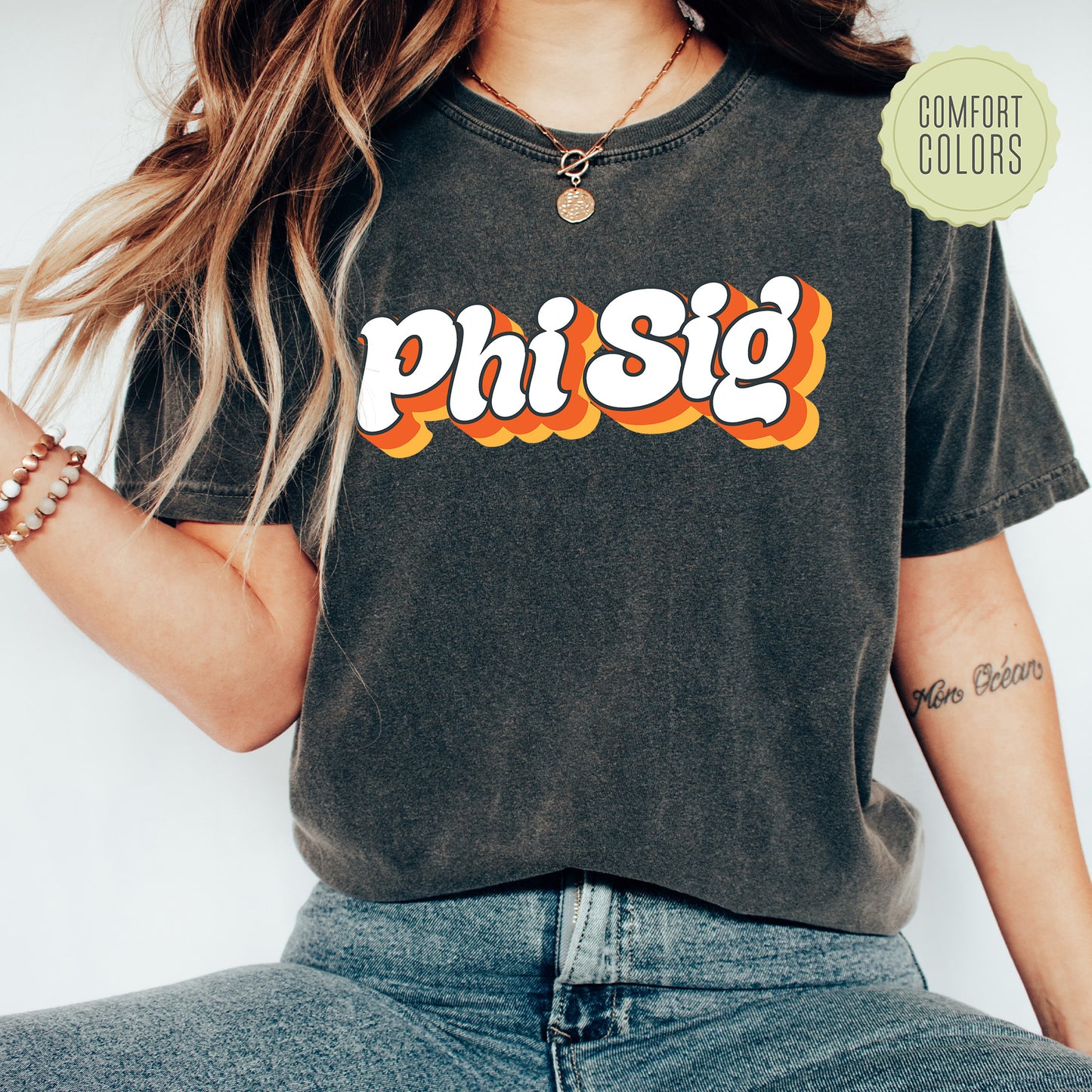 a woman wearing a phisg t - shirt with the word phisg on it
