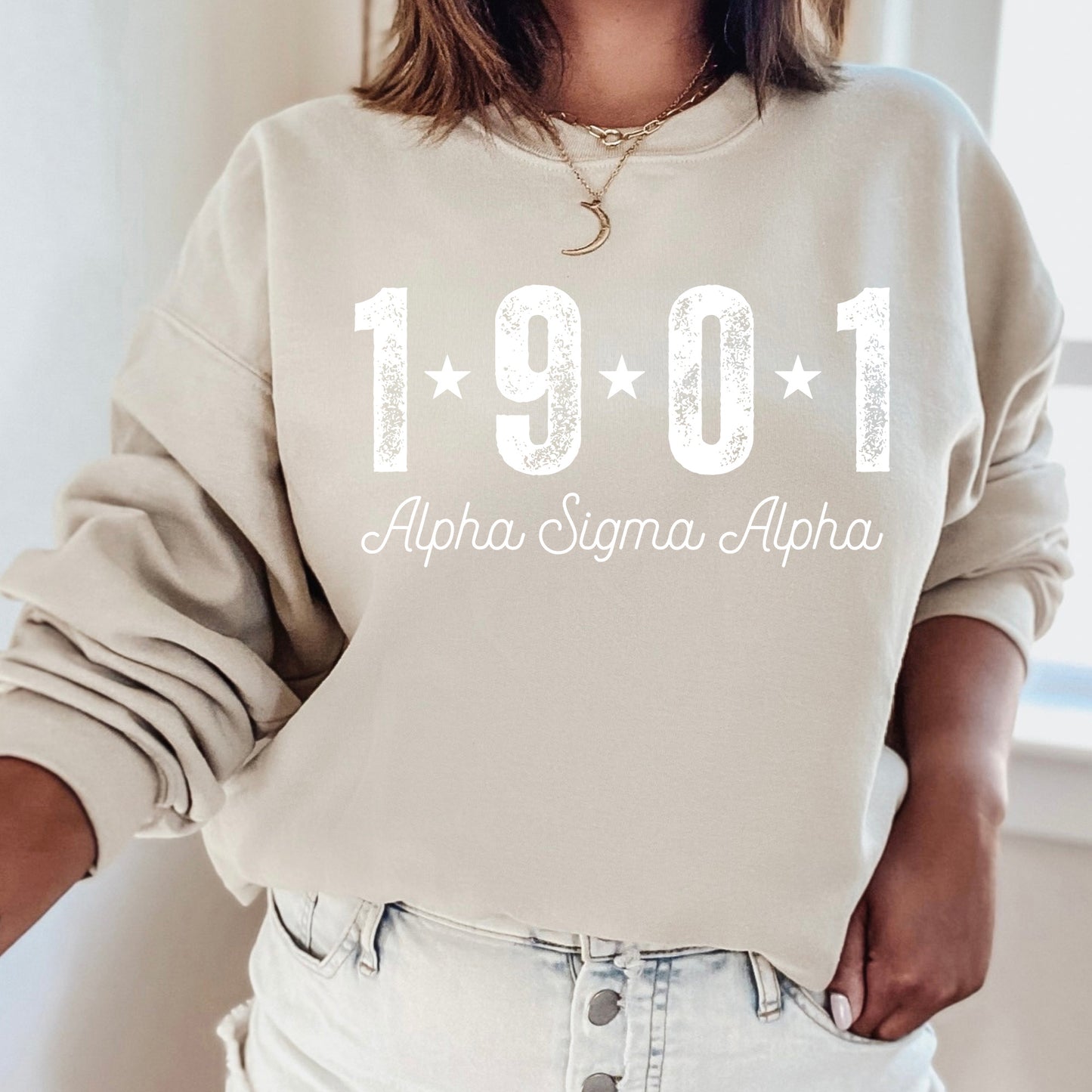 a woman wearing a sweatshirt with the year 1911 printed on it
