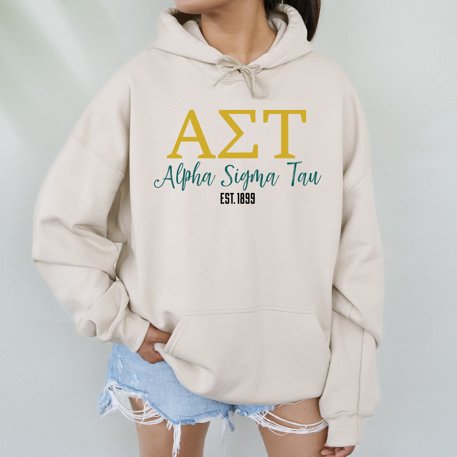 a woman wearing a white hoodie with the word azt on it