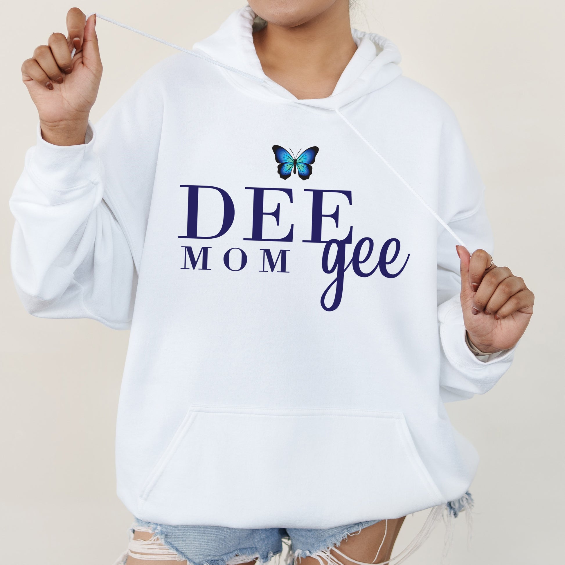 a woman in a white hoodie that says deef mom gee
