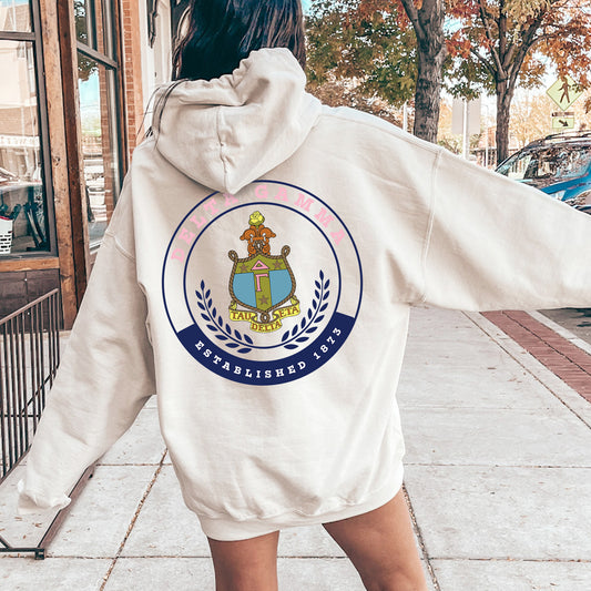 a woman in a white hoodie is walking down the street