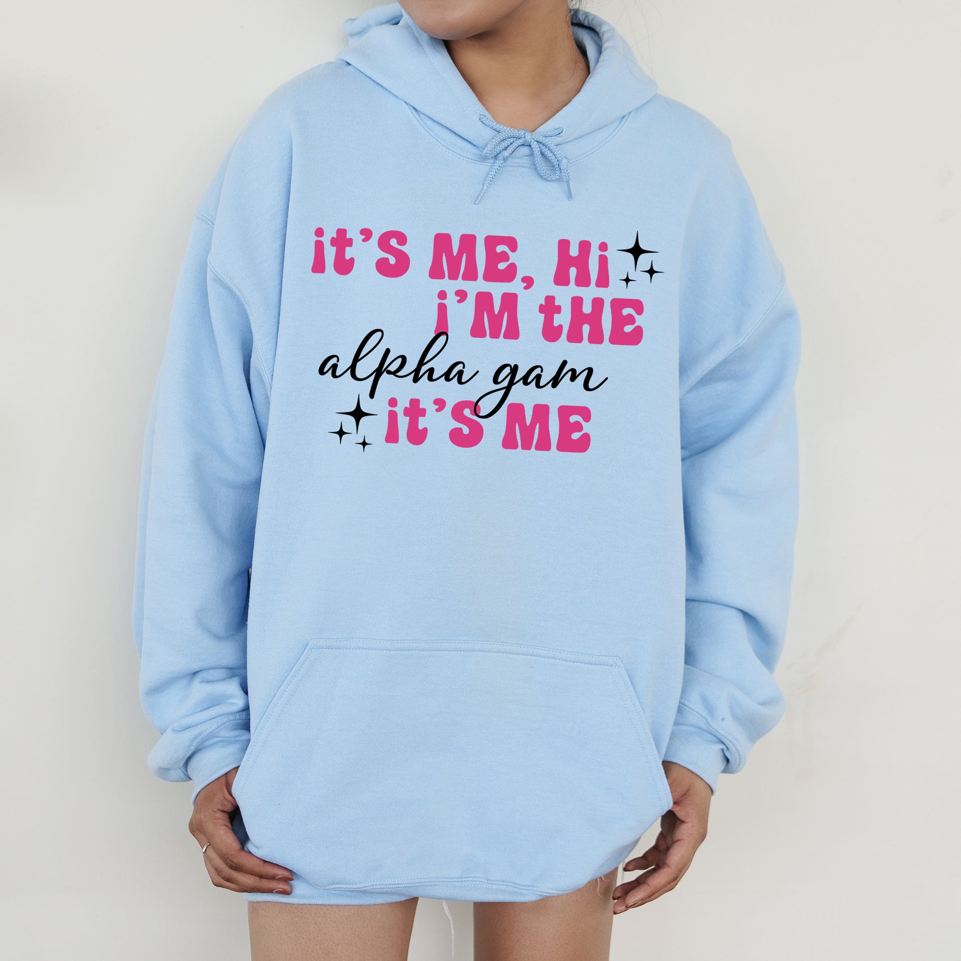 a person wearing a blue hoodie that says it's me, i '