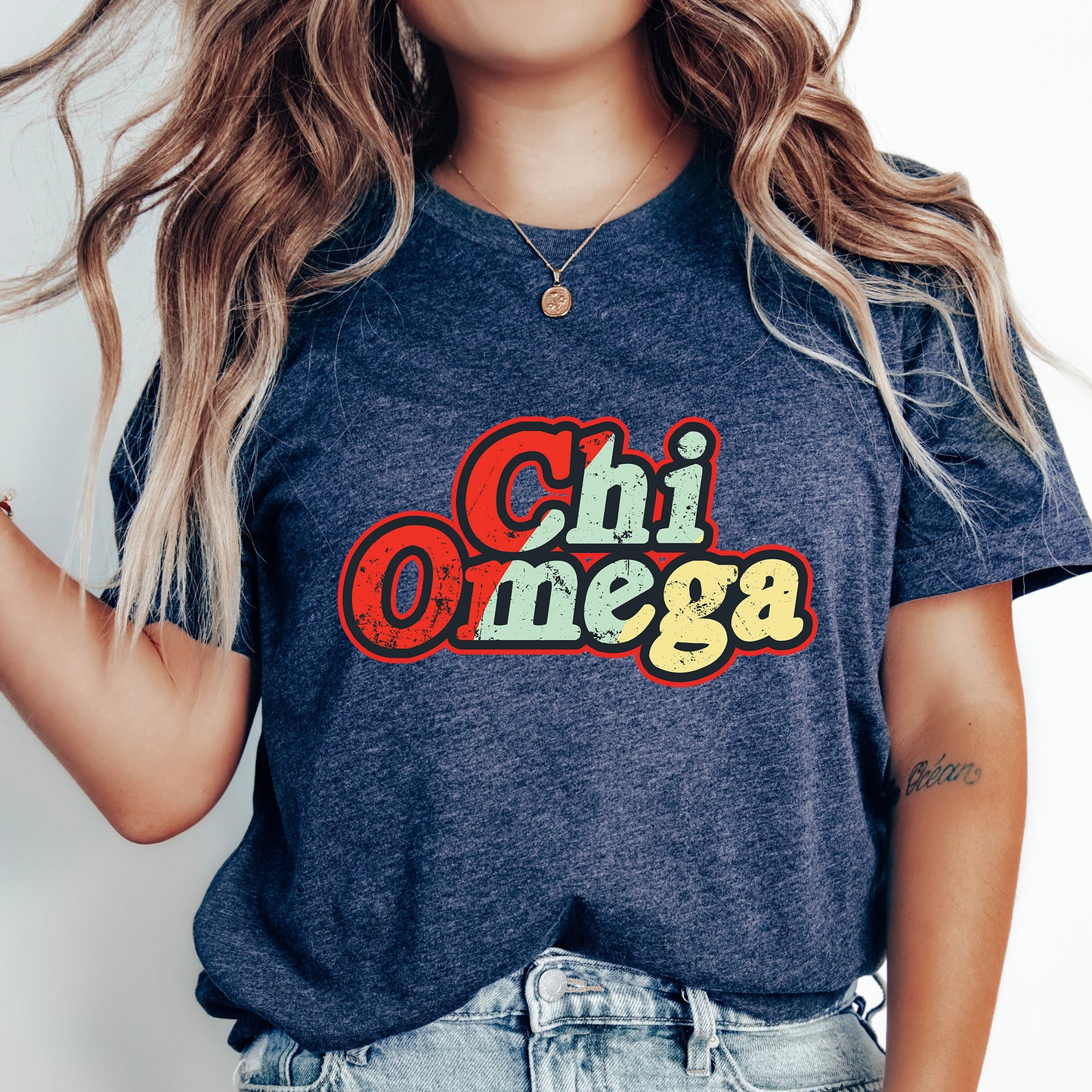 a woman wearing a t - shirt that says chi omega