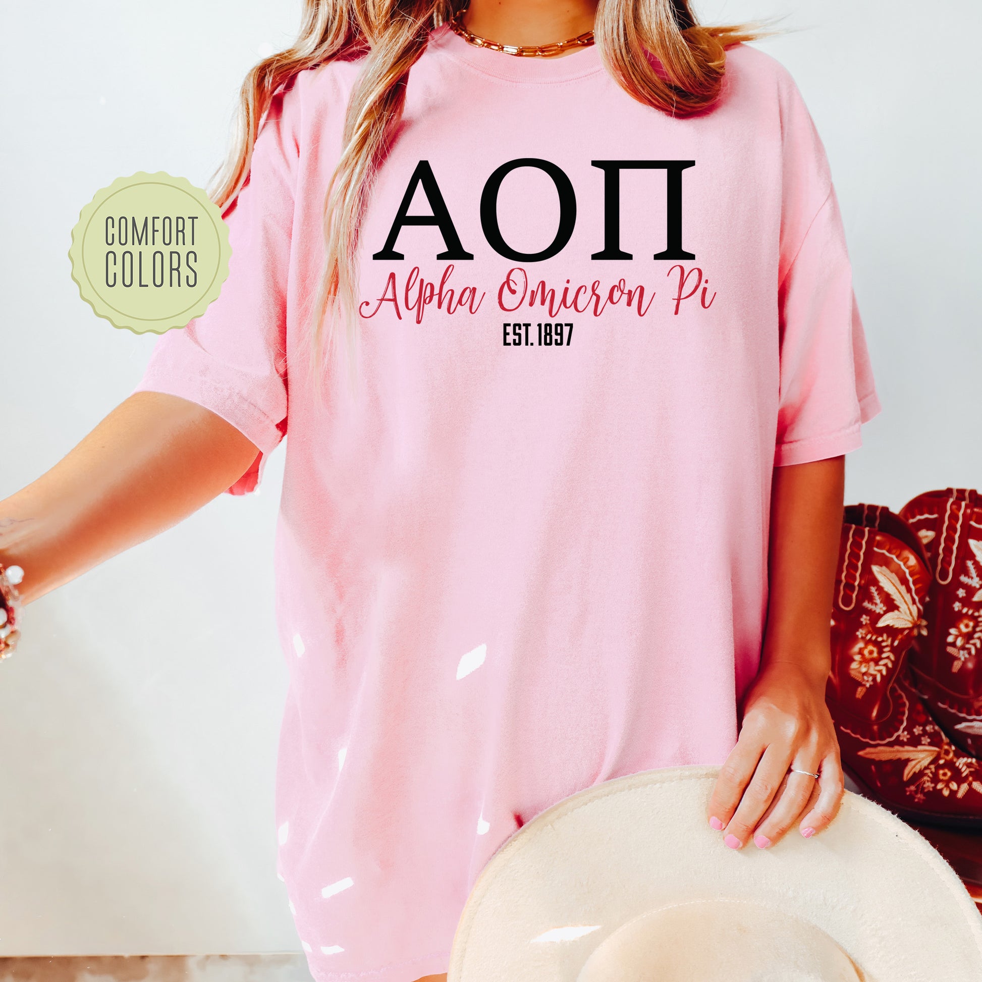 a woman wearing a pink shirt and hat