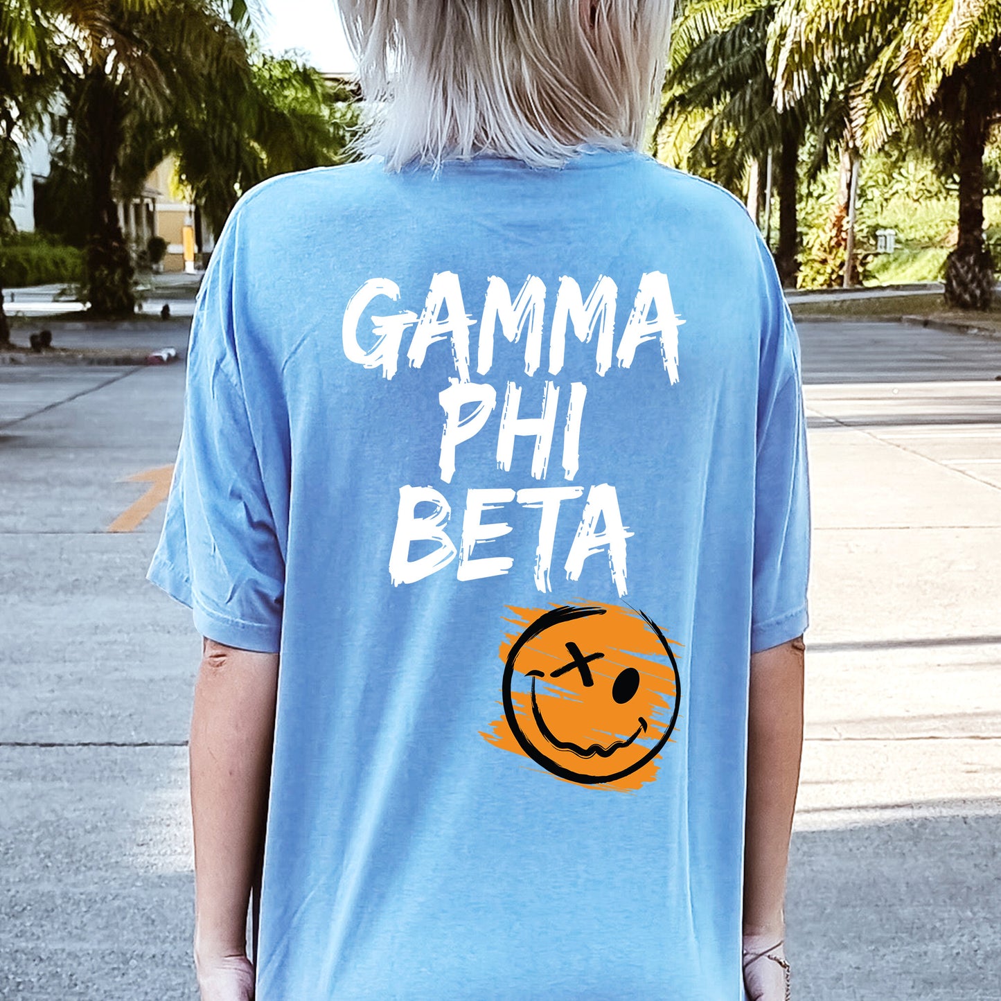 a person wearing a blue shirt with a smiley face on it