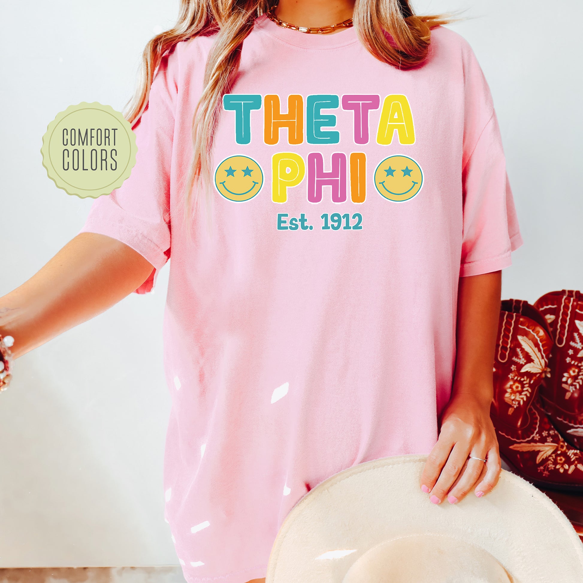 a woman wearing a pink shirt and hat