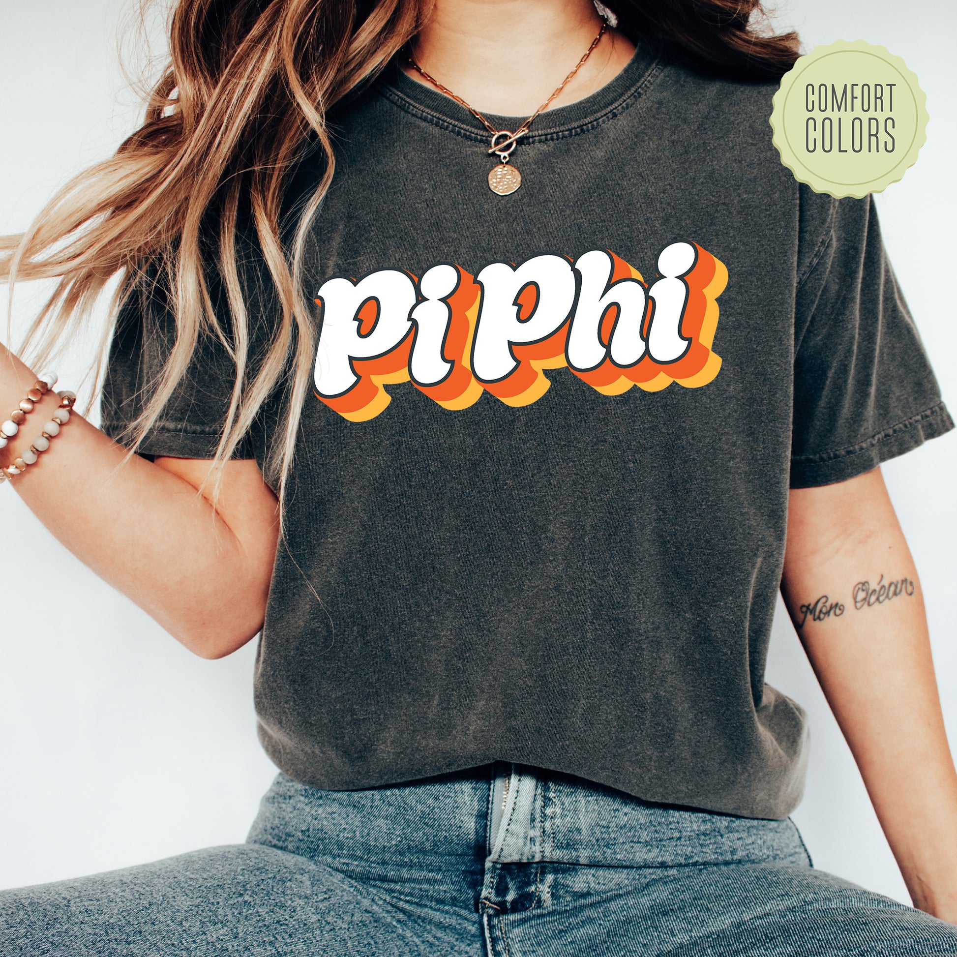 a woman wearing a black shirt with the word pippi on it