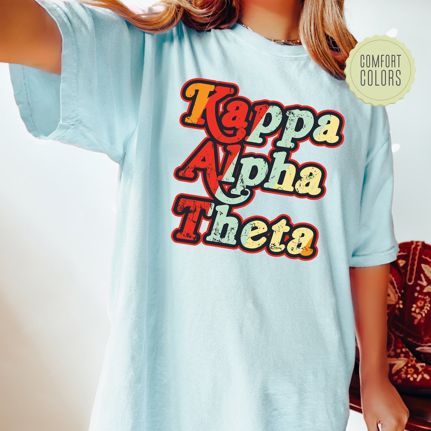 a woman wearing a light blue t - shirt with the words toppa aloh