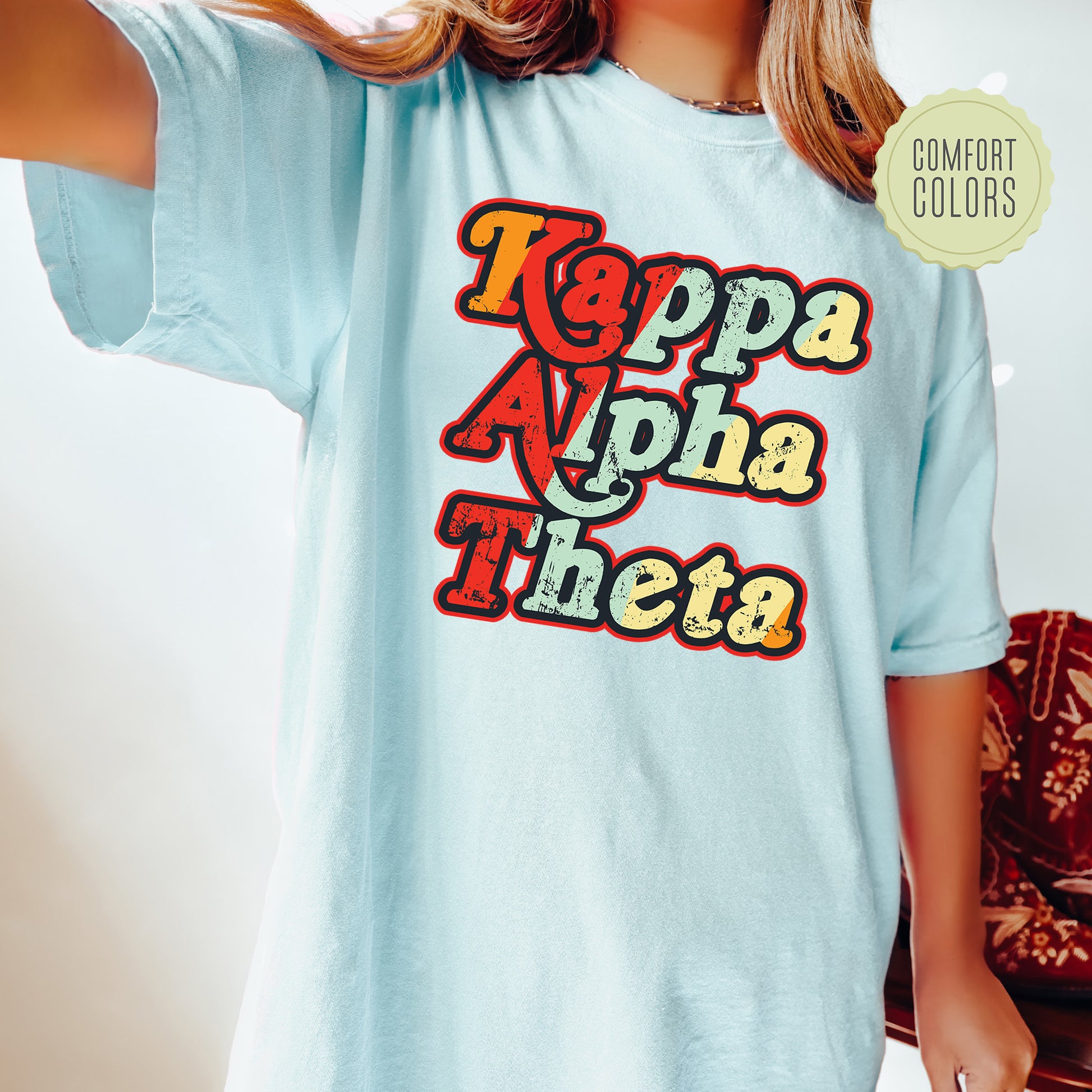 a woman wearing a light blue t - shirt with the words toppa aloh