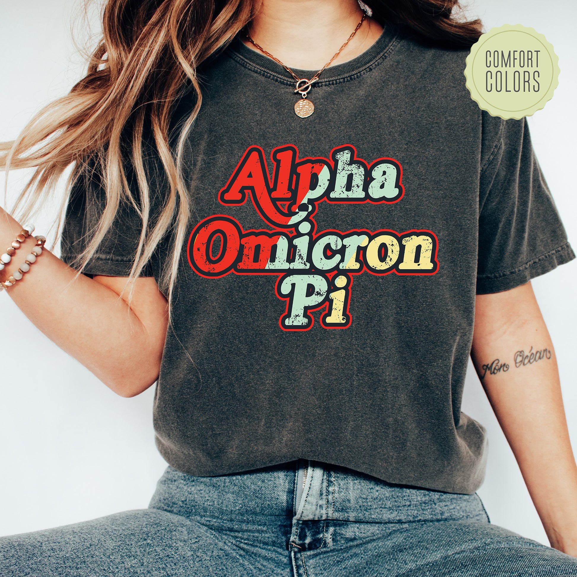 a woman wearing a black shirt with the word aloha on it