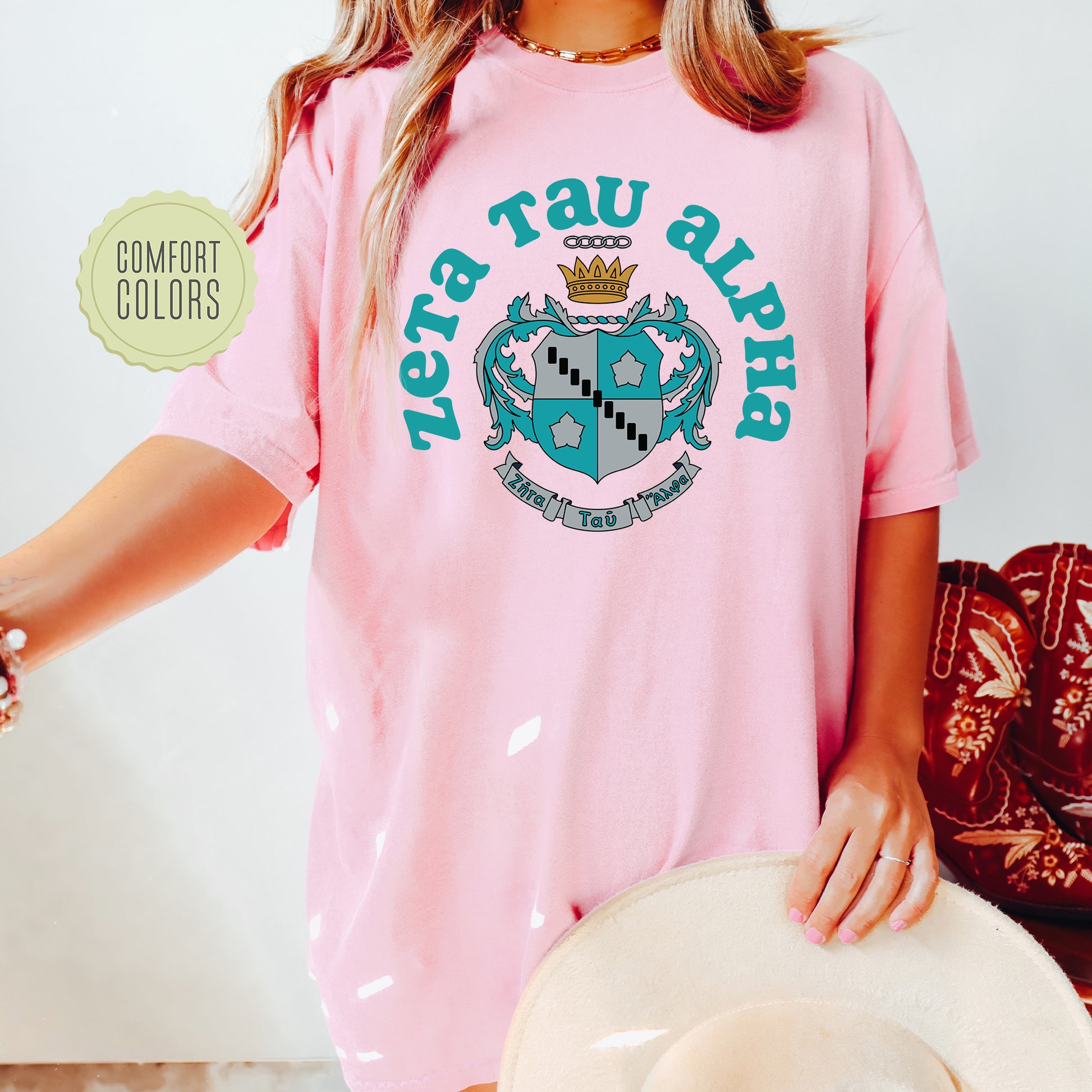a woman wearing a pink shirt and hat