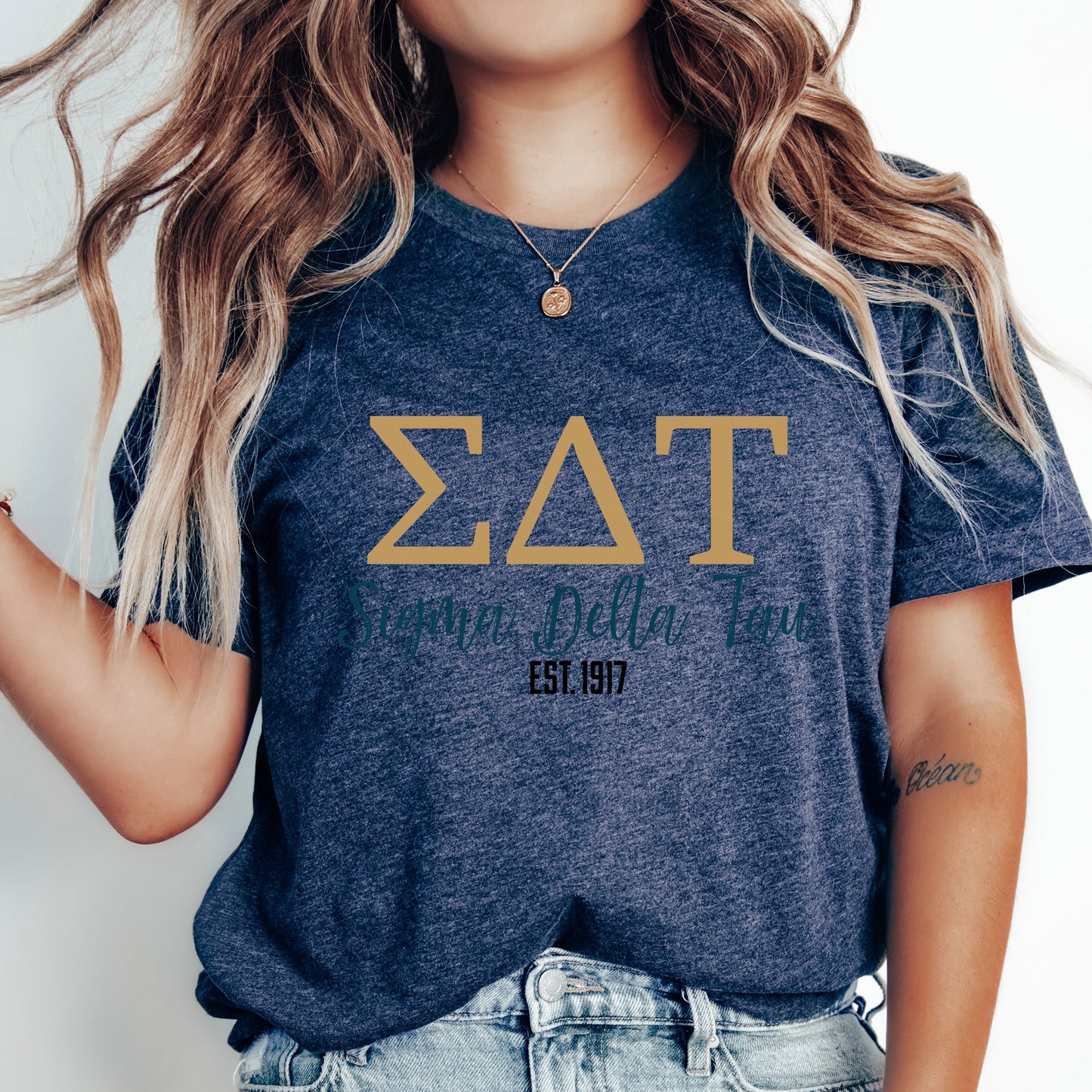 a woman wearing a t - shirt with the letters fraternity on it