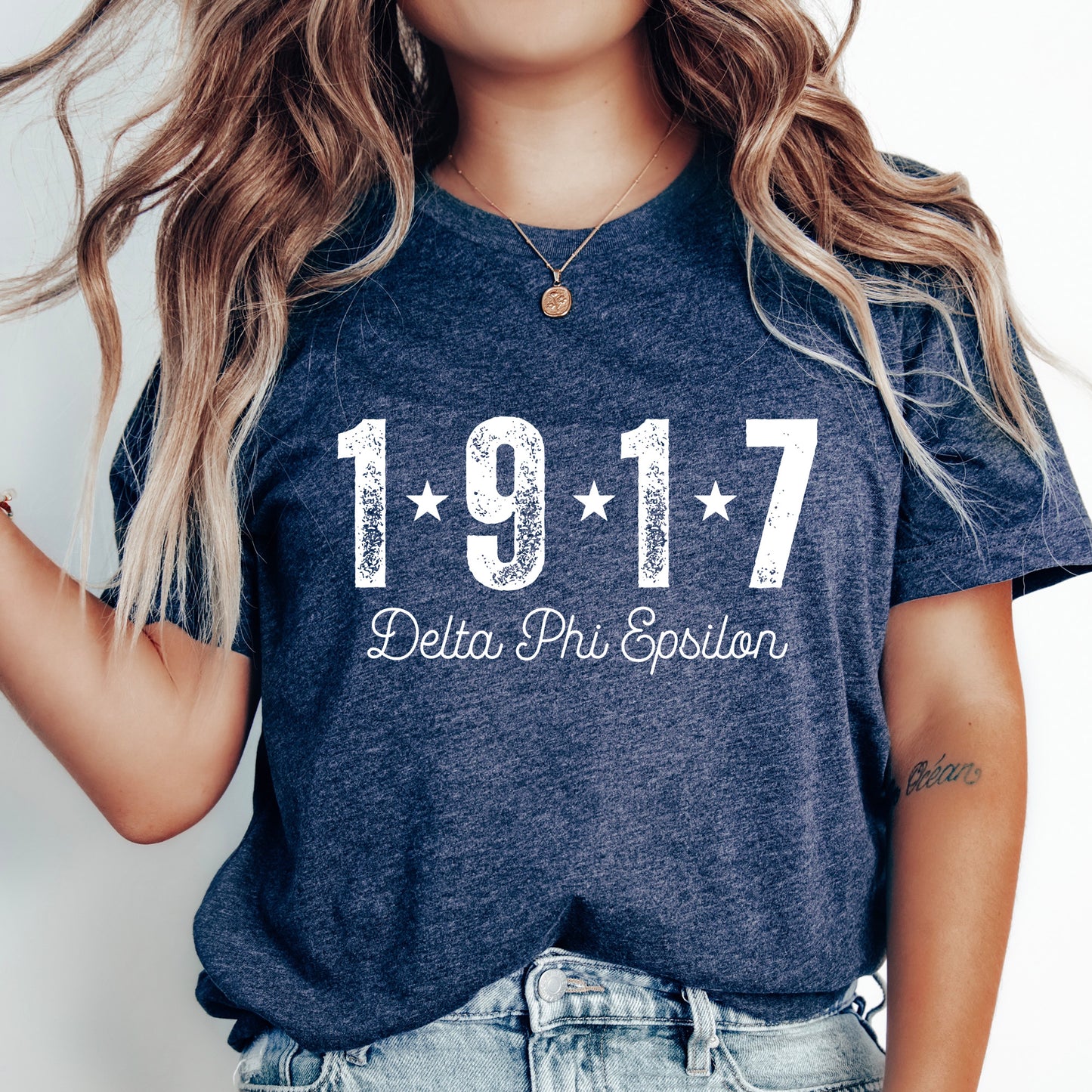 a woman wearing a t - shirt with the number 1917 written on it