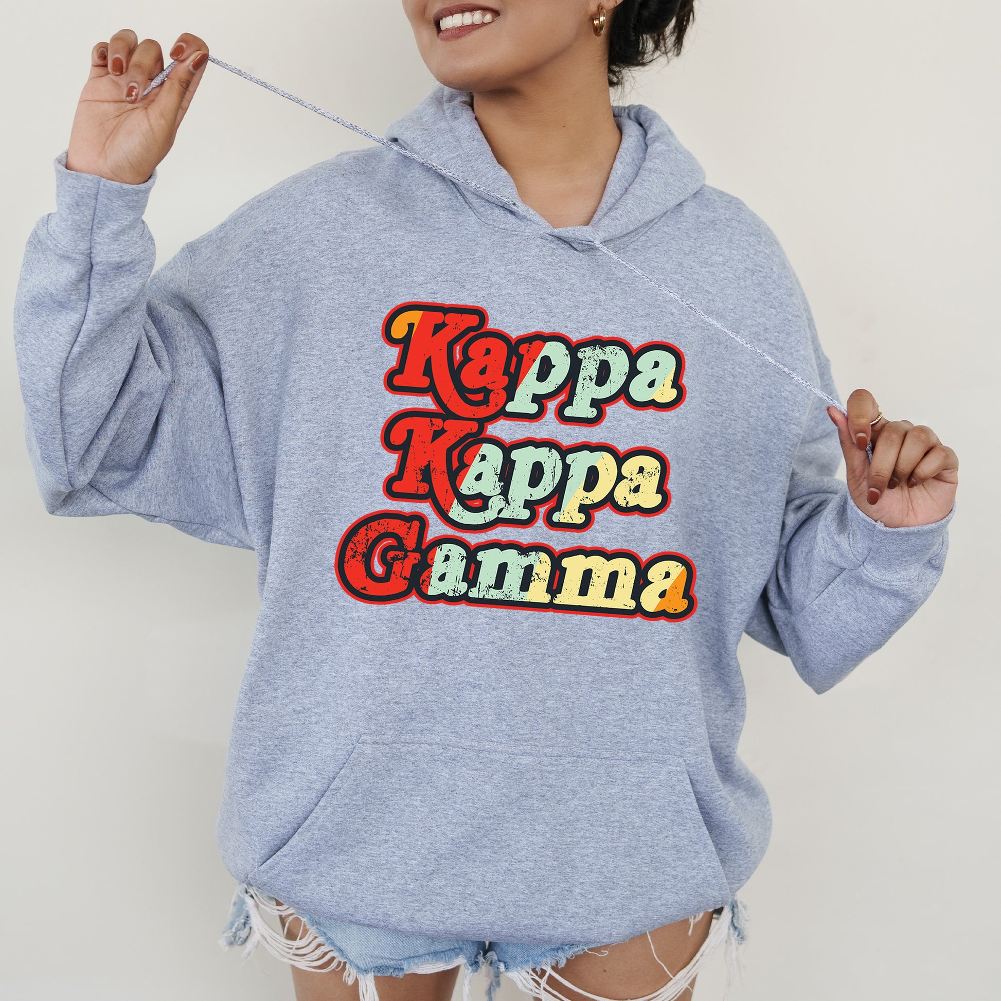 a woman wearing a blue hoodie with the words kapp kapp kapp