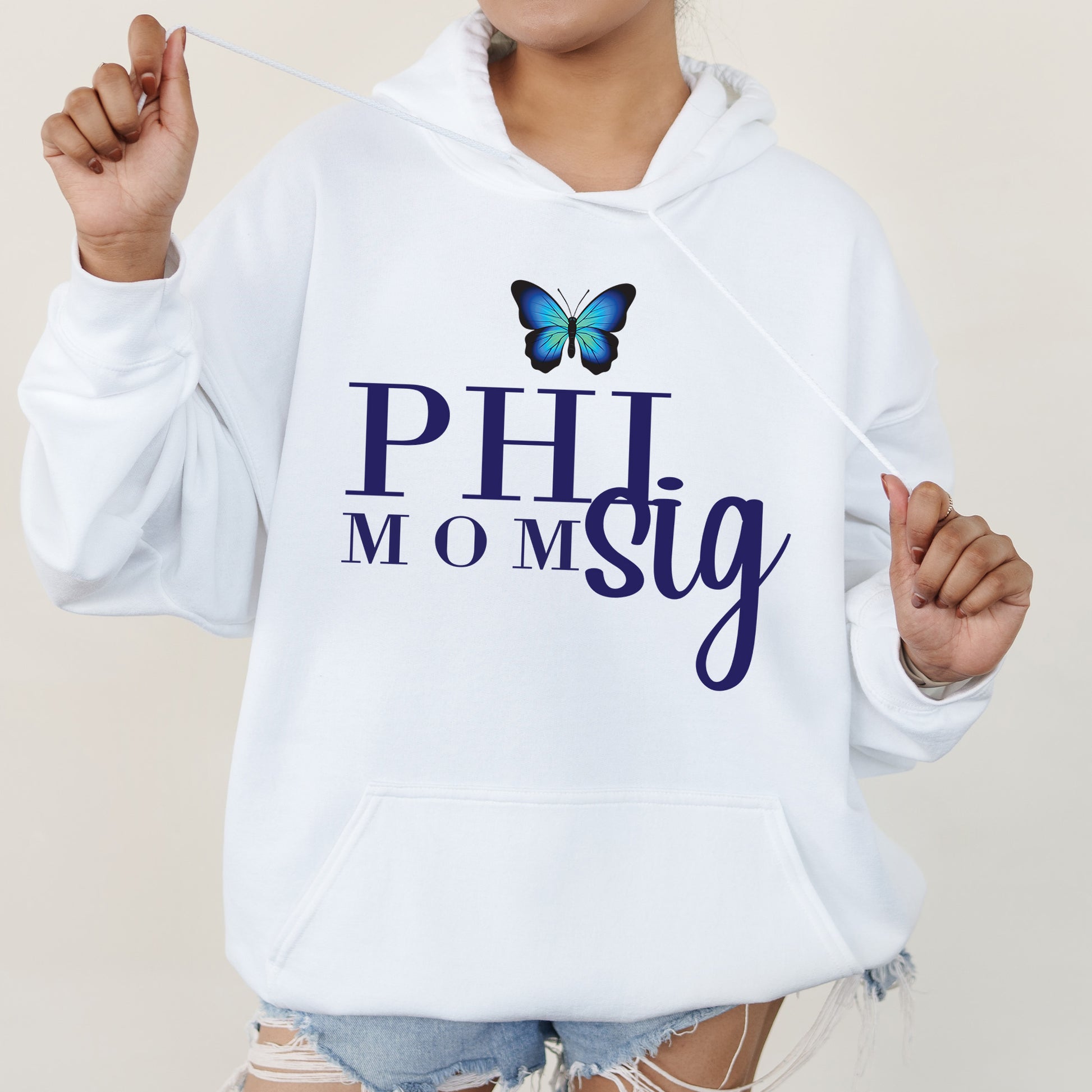 a woman wearing a white hoodie with a butterfly on it