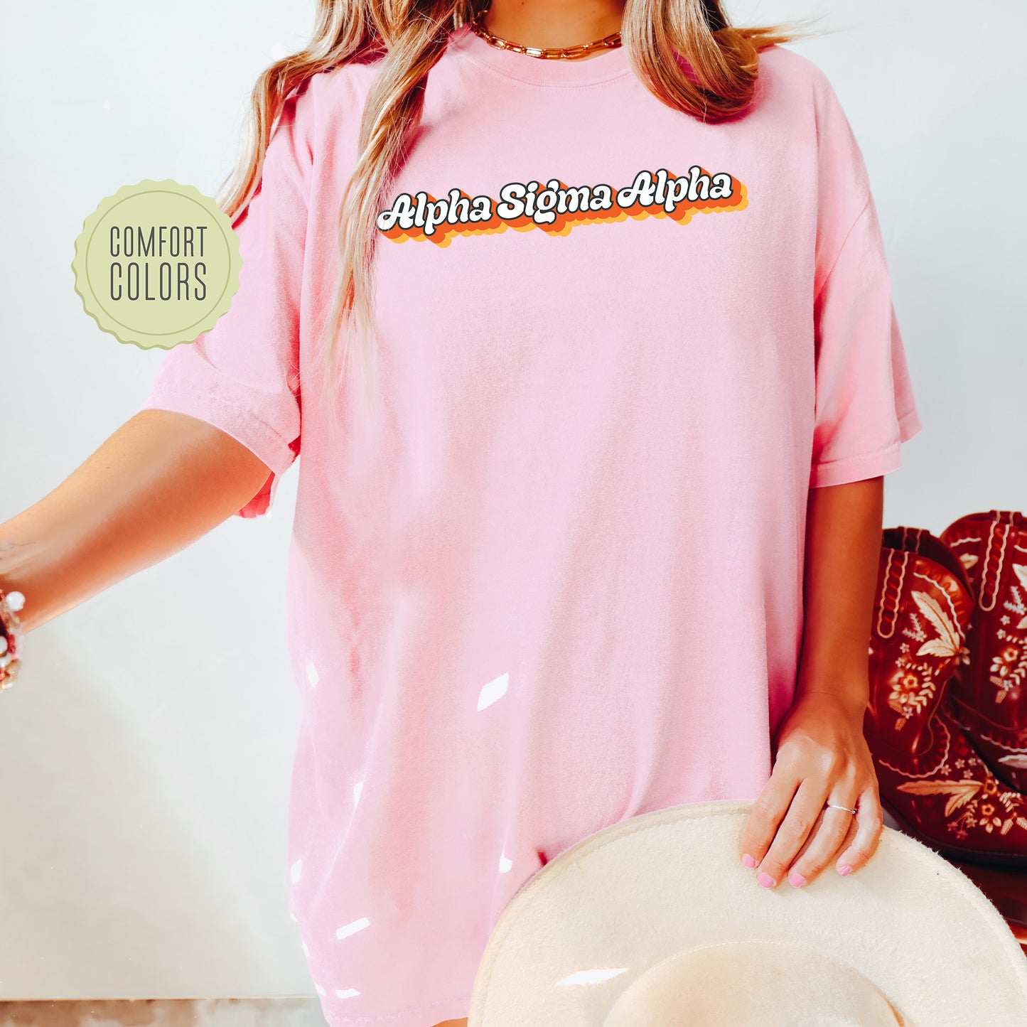a woman wearing a pink shirt and hat